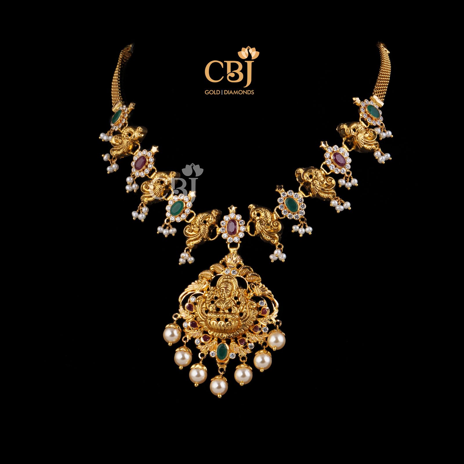 A short light weight necklace featuring rubies