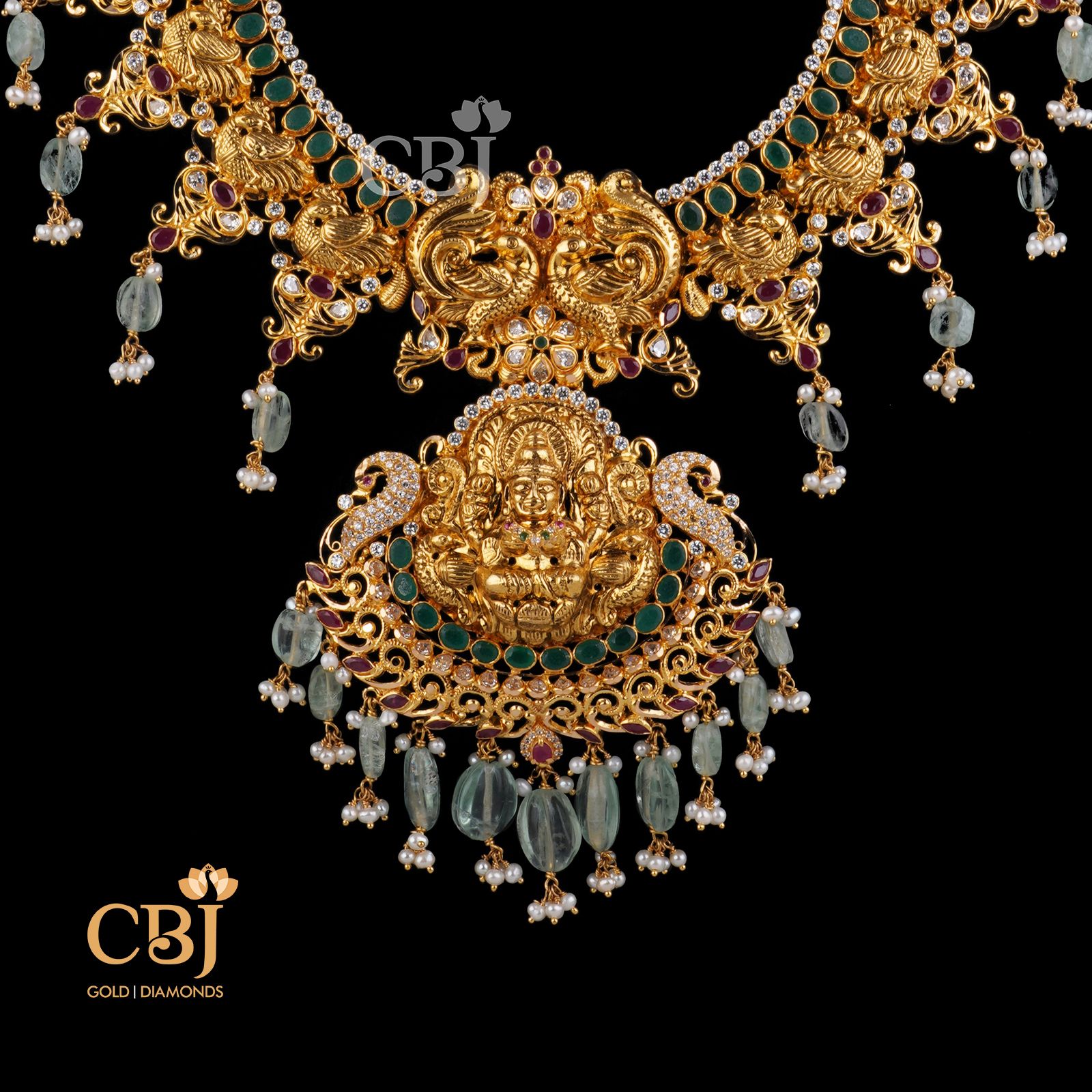 A traditional fusion mango light weight haram featuring the divine Goddess Lakshmi in its design.