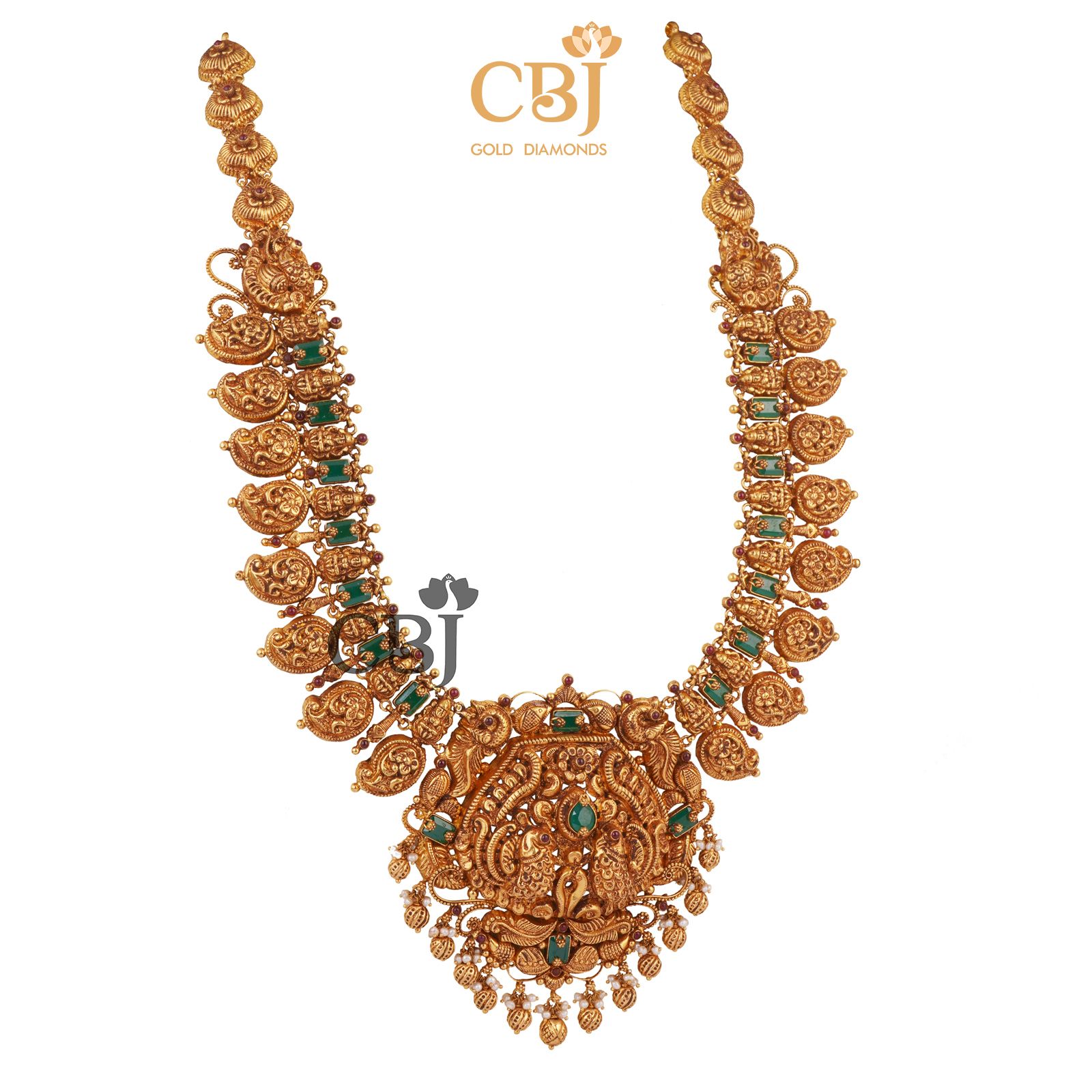 An antique mango U-Haram studded with emerald stones.