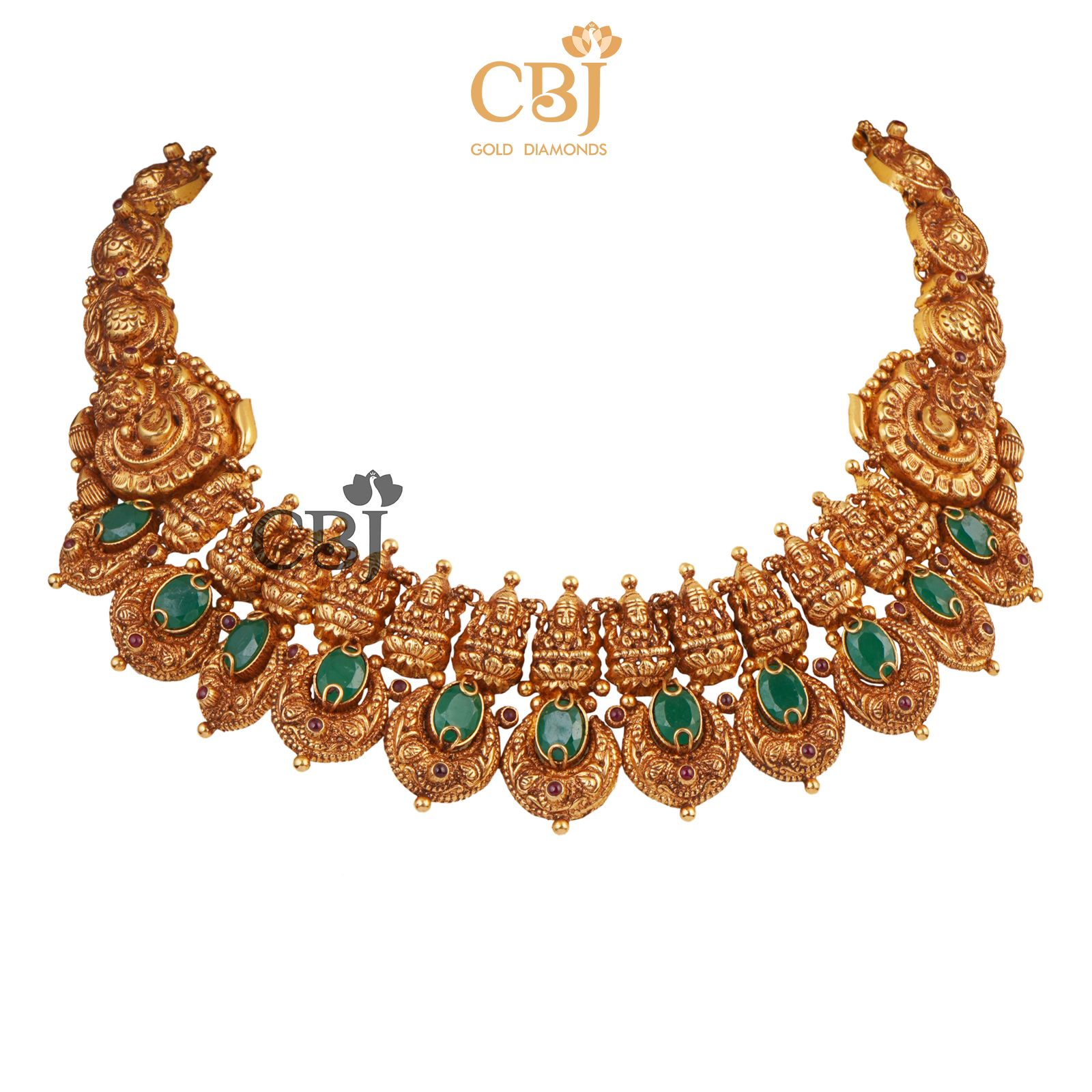 A short antique deep nakas haram studded with emerald stones.