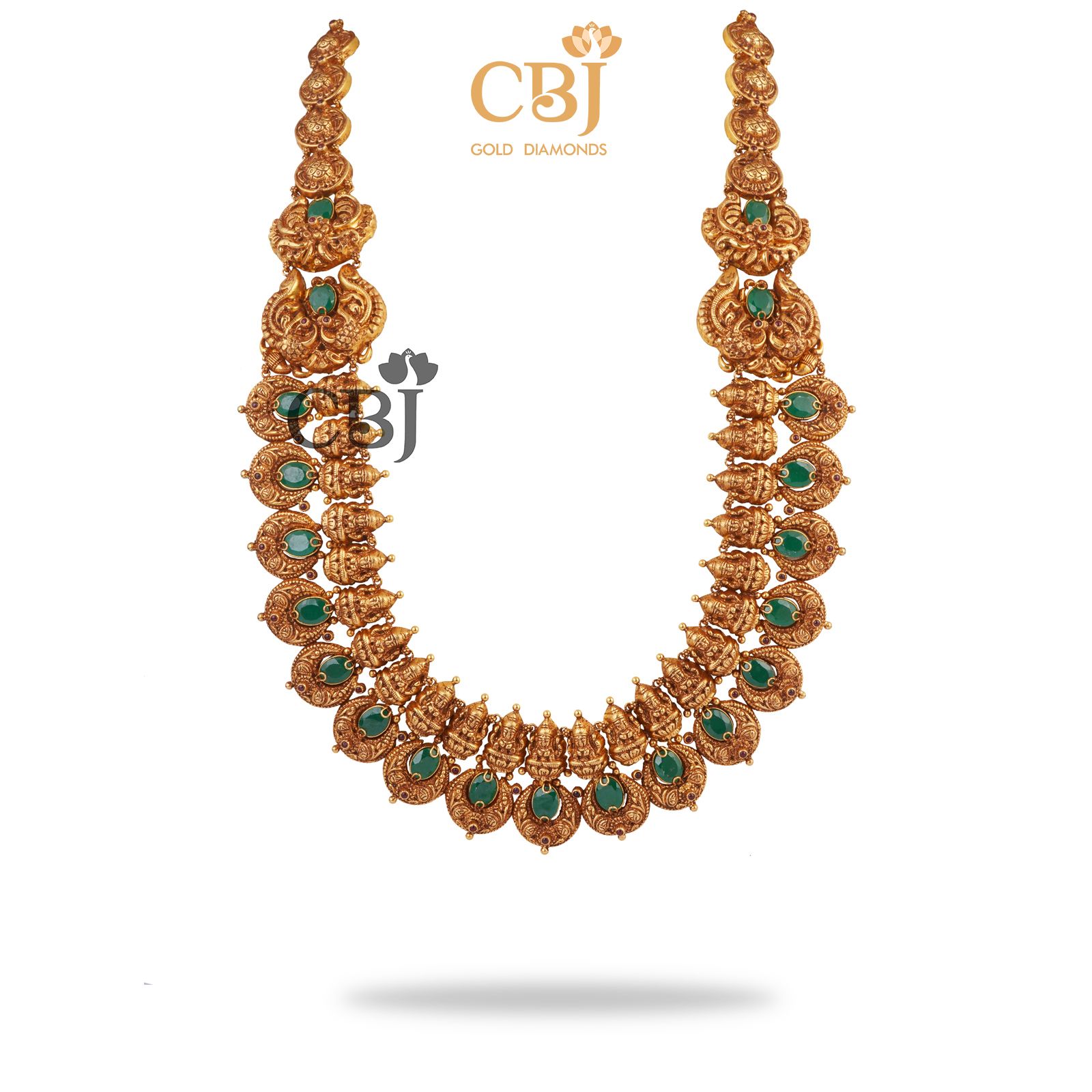 A semi long chand U-haram featuring emerald stones.