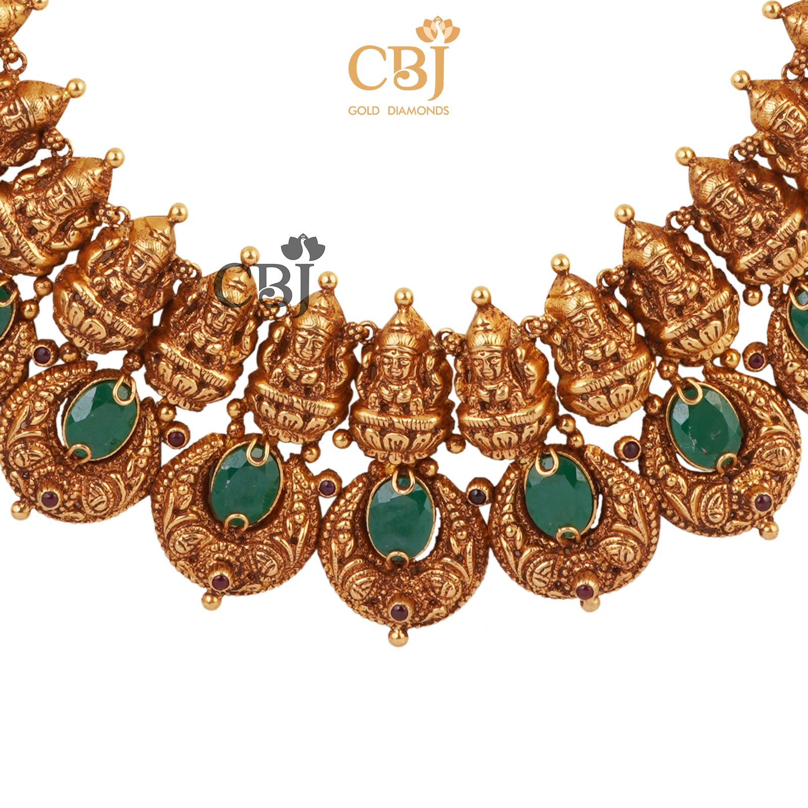 A semi long chand U-haram featuring emerald stones.