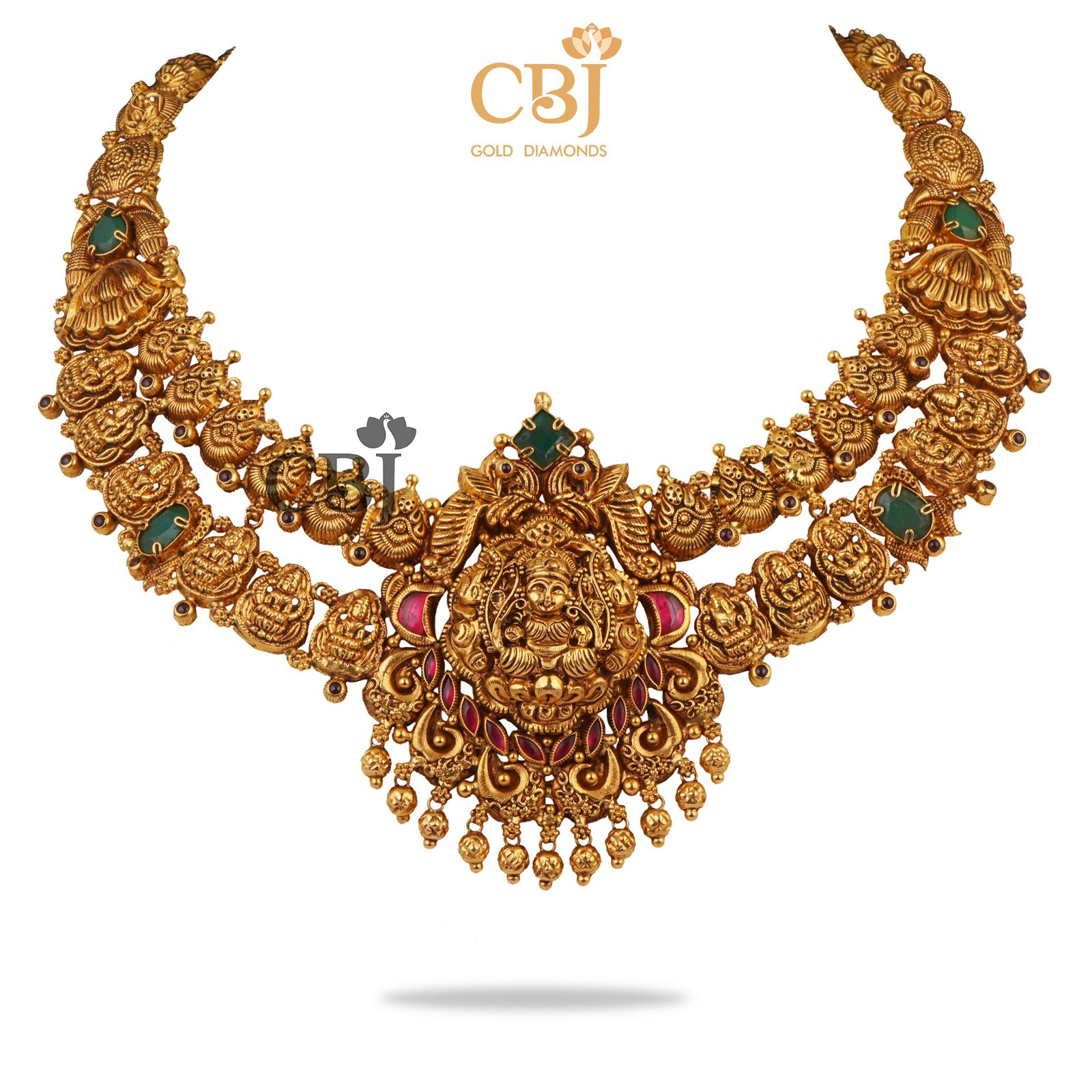 A 2-Step antique nakashi necklace featuring ruby and emerald stones.