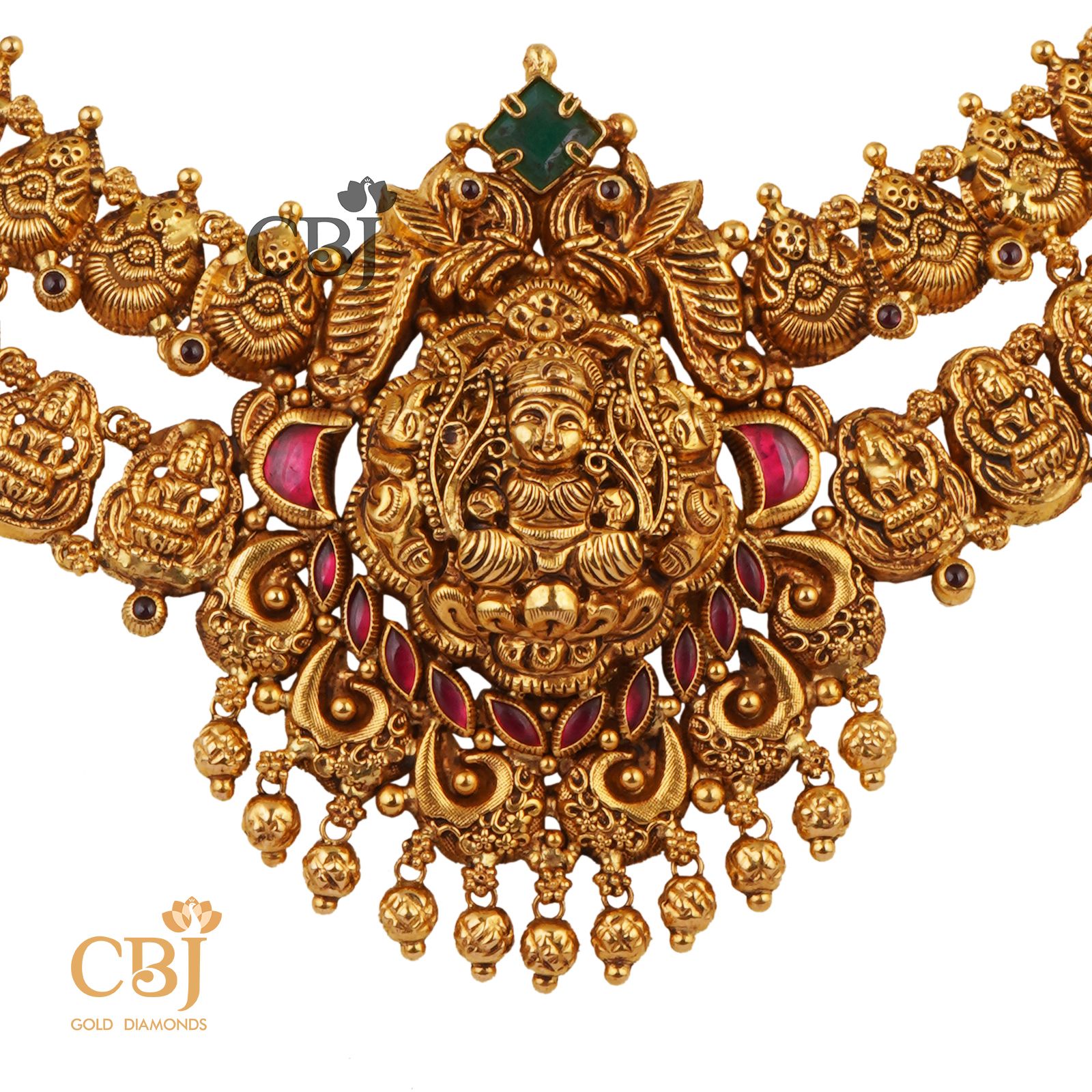 A 2-Step antique nakashi necklace featuring ruby and emerald stones.