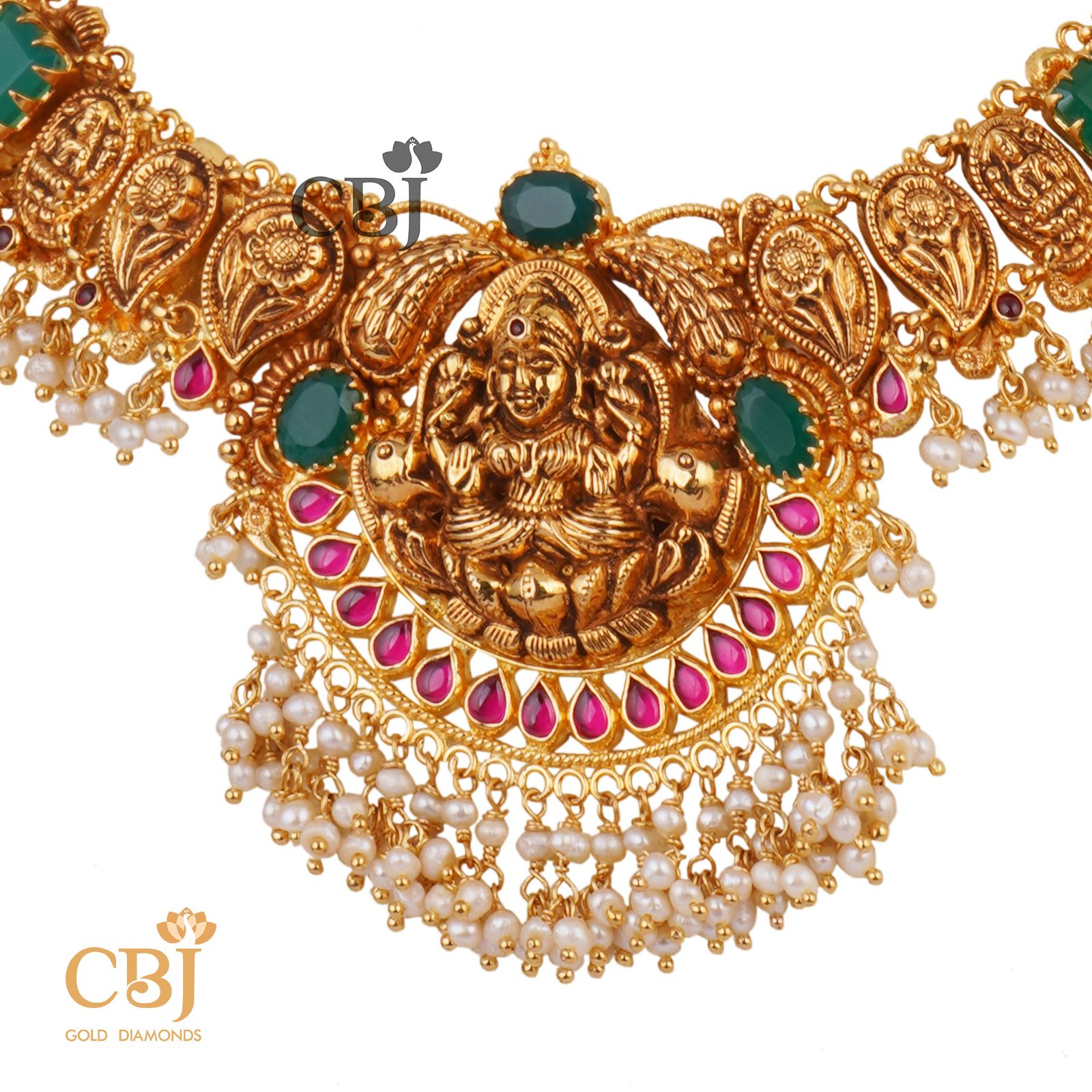 An antique Lakshmi light weight nakashi necklace featuring emerald stones and micro pearls.
