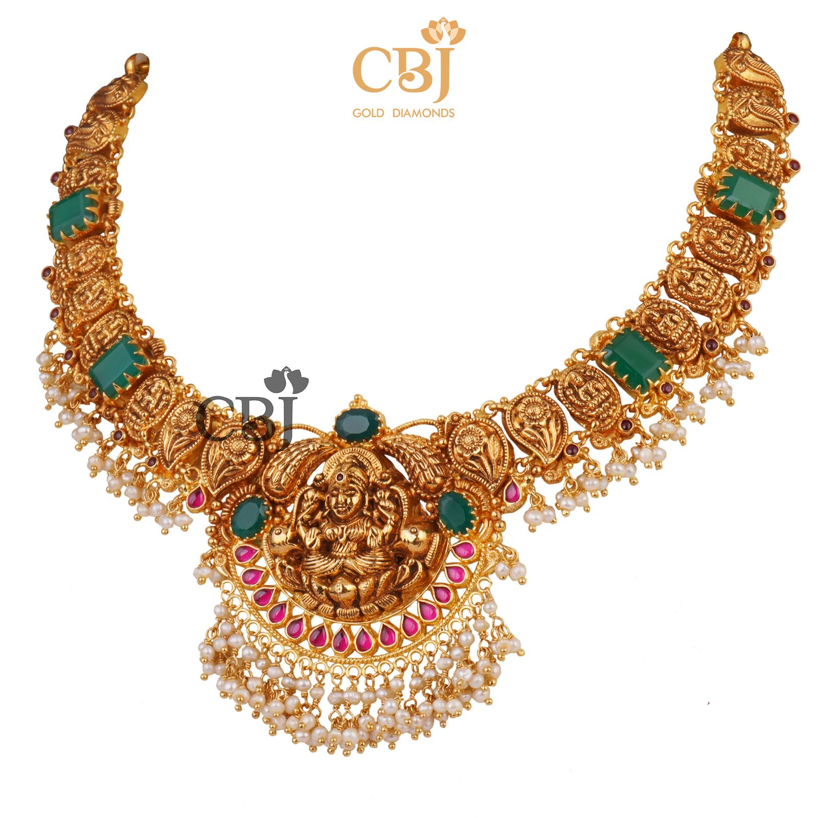 An antique Lakshmi light weight nakashi necklace featuring emerald stones and micro pearls.
