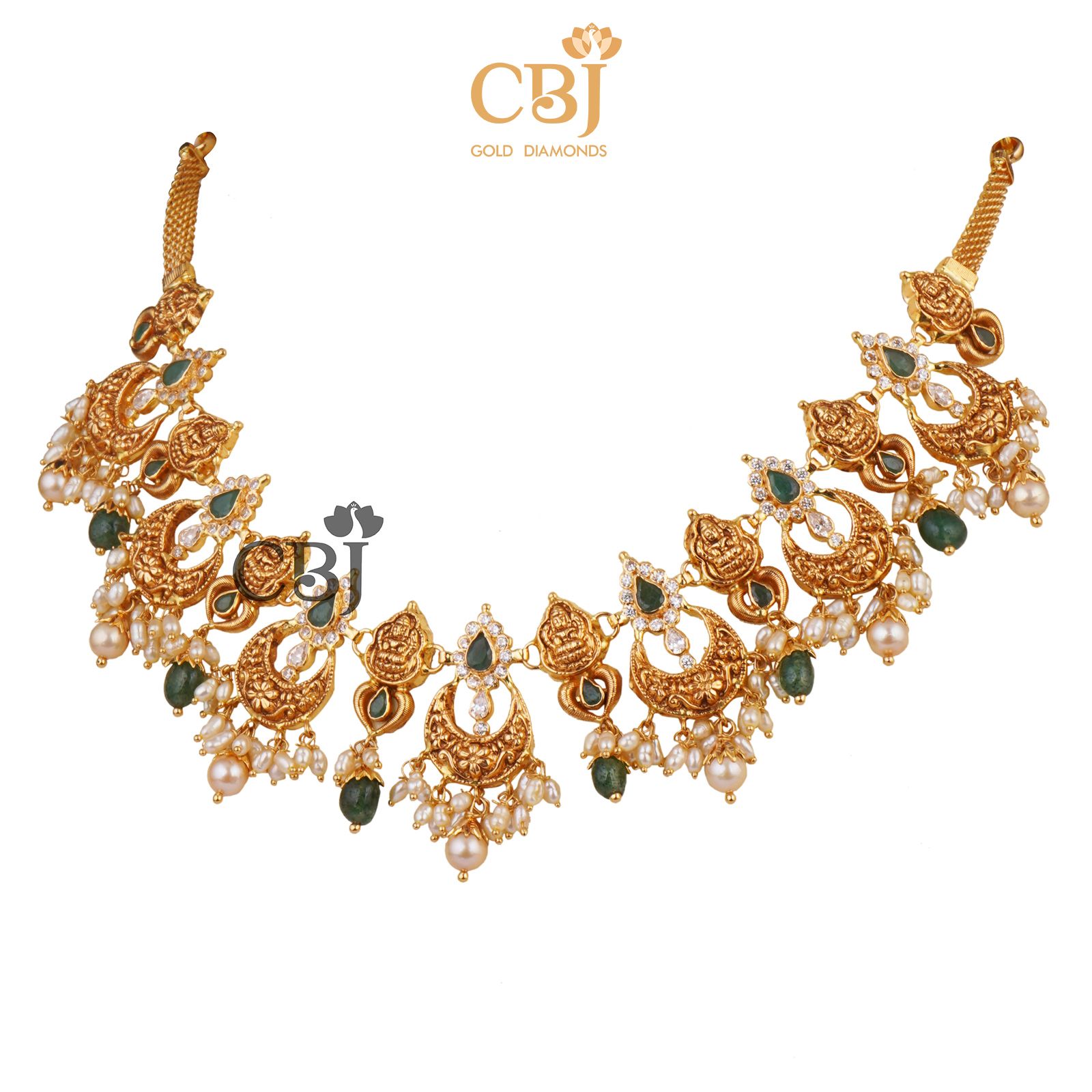 A light weight chand necklace featuring micro pearls and emerald drops.