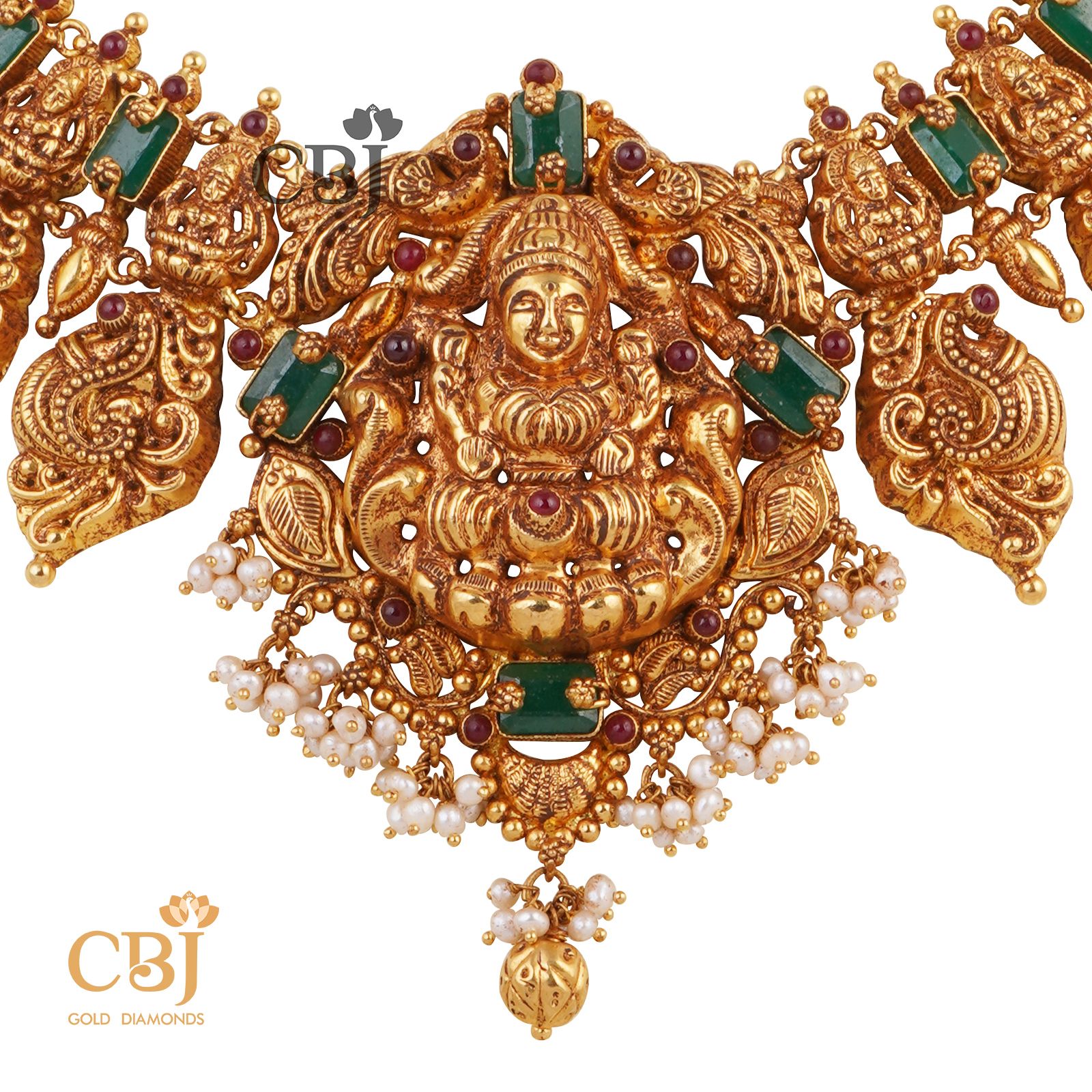 A short Lakshmi haram featuring emeralds and micro pearls.