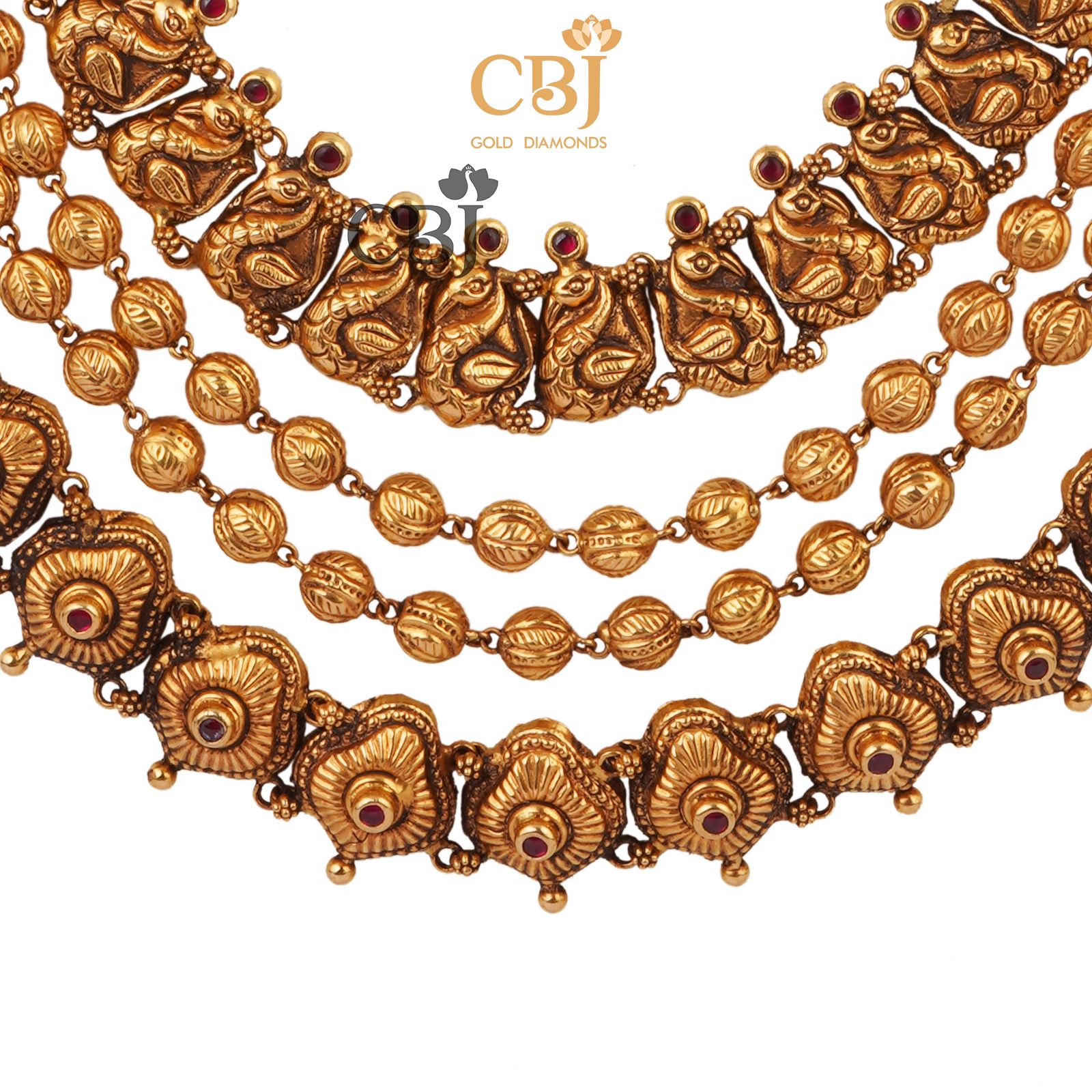 A 3 step nakashi necklace featuring an antique design.