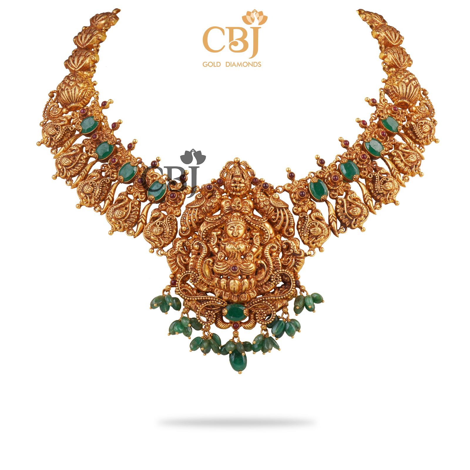 A luxurious Lakshmi nakas necklace studded with emerald stones.