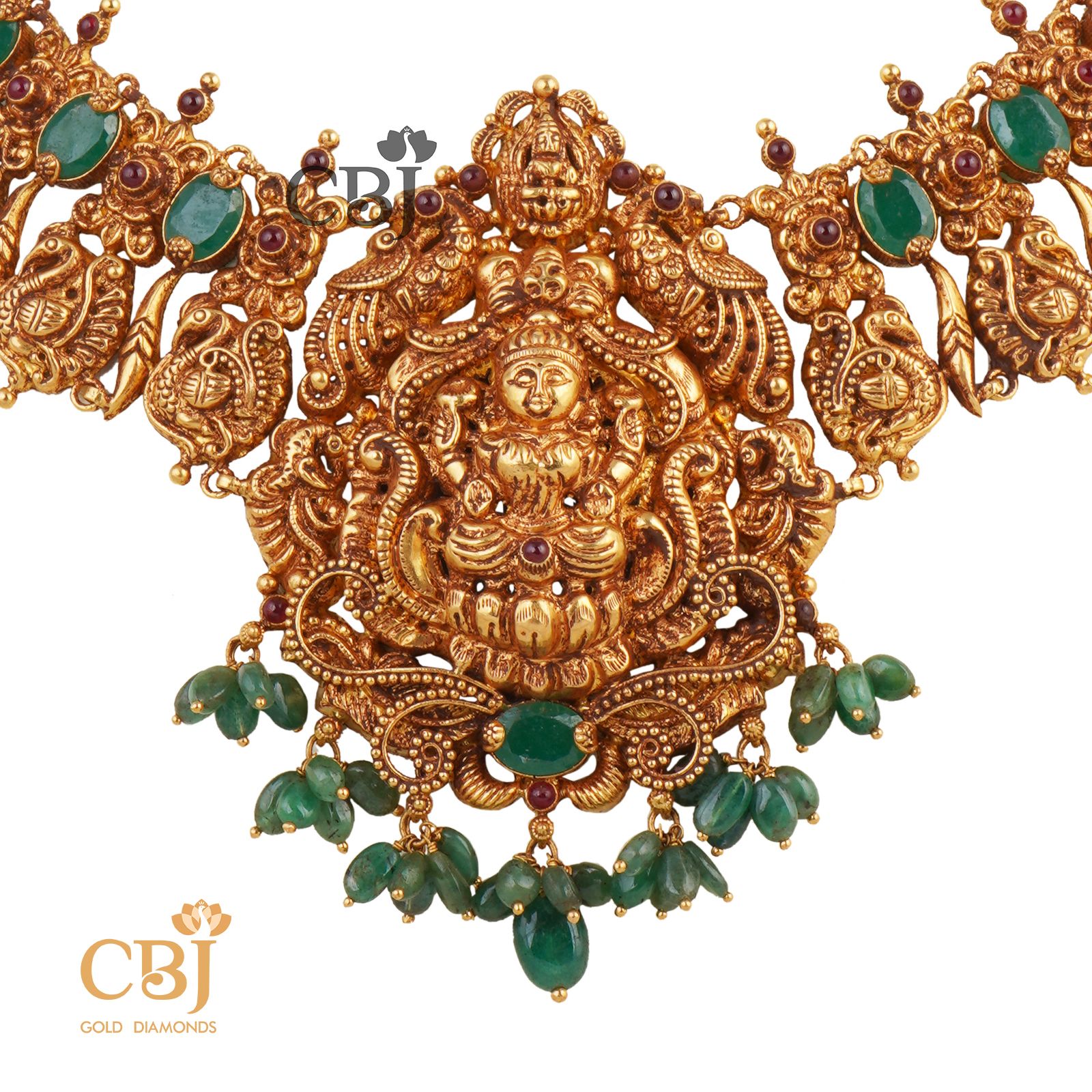A luxurious Lakshmi nakas necklace studded with emerald stones.