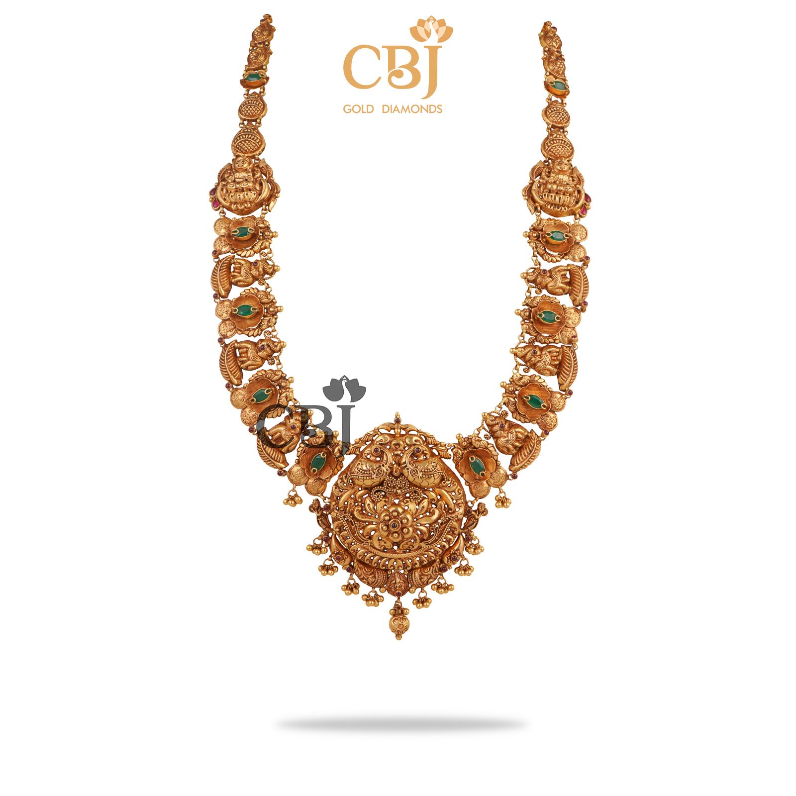 Deep nakas haram studded with emerald stones featuring elephant motifs.