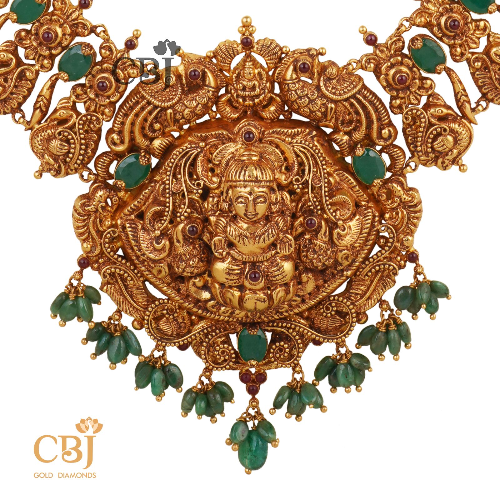 A traditional royal nakas U-Haram studded with emerald stones.