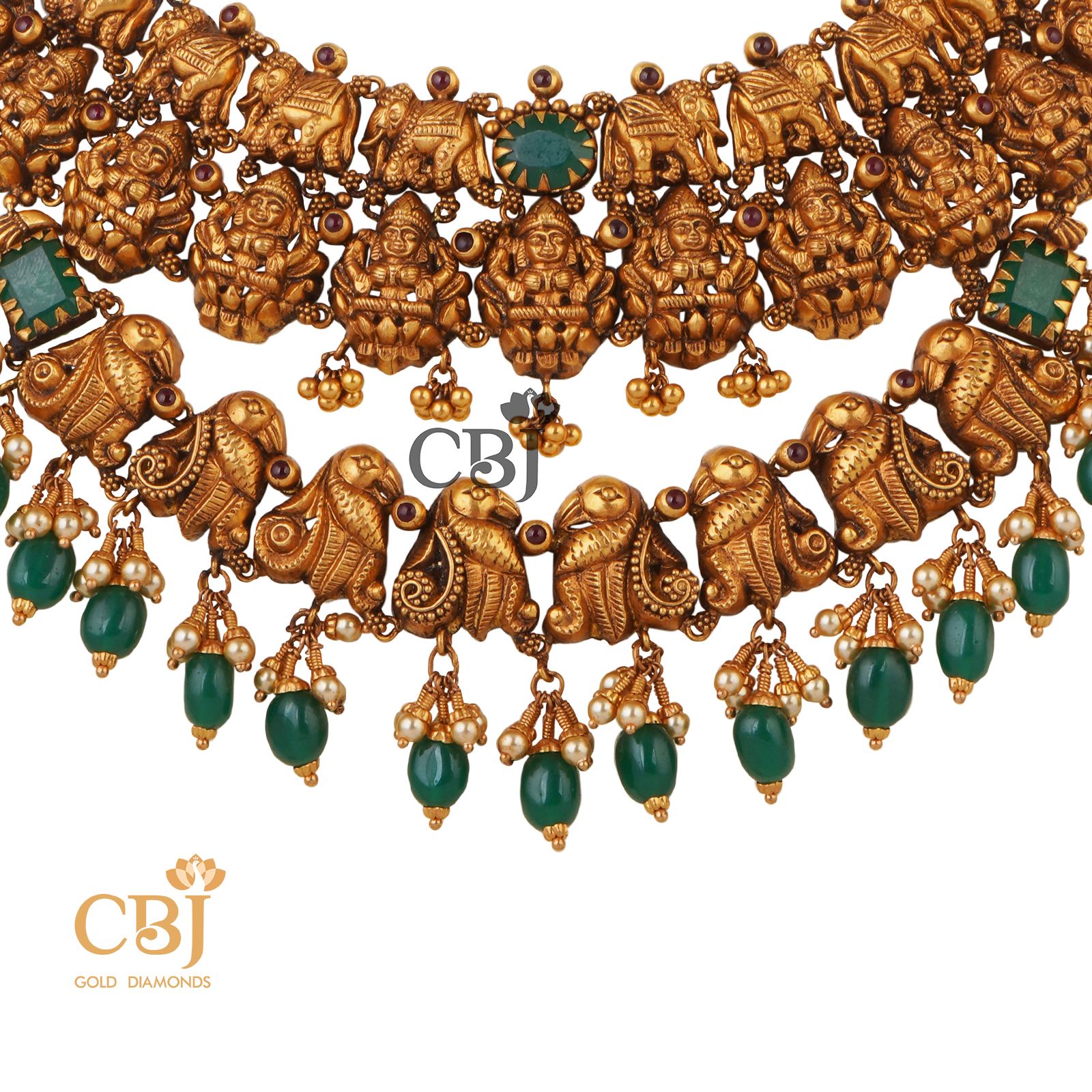 A one of a kind 2 step nakashi necklace featuring stunning motifs and emerald stones.