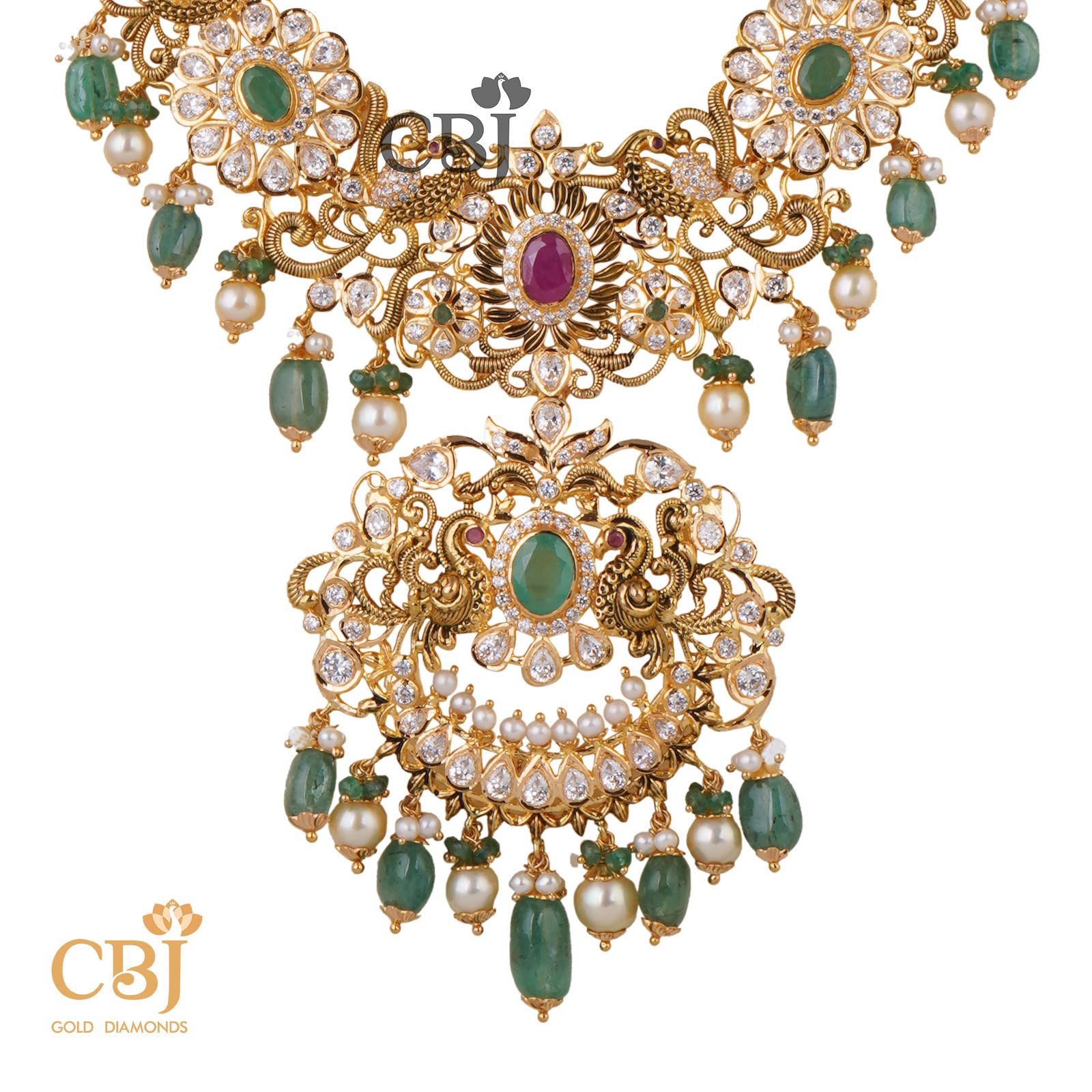 A unique designer U-haram featuring a CZ pachi framework with suspended emeralds and pearls.