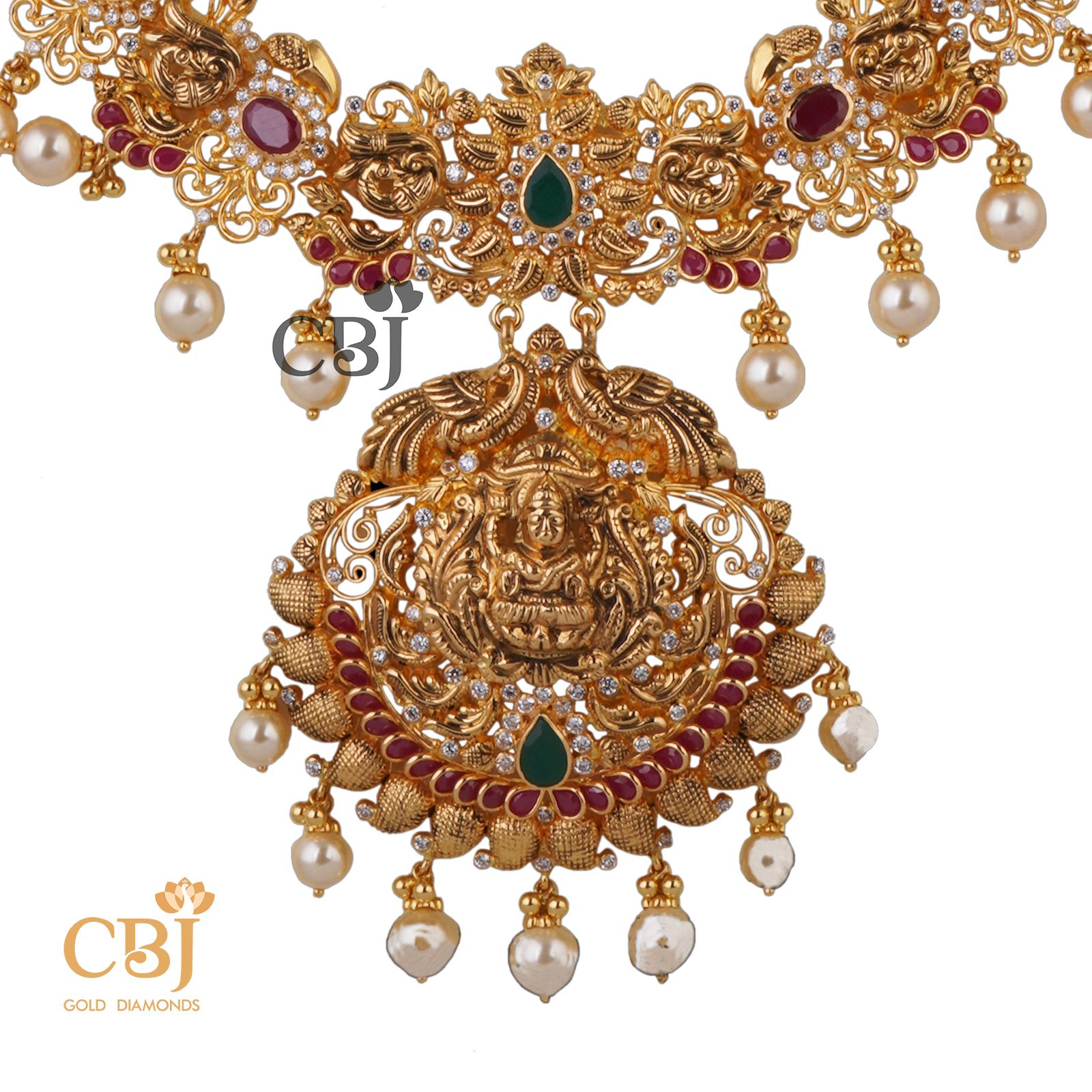 A light weight classic designer U- haram featuring  rubies and emeralds.