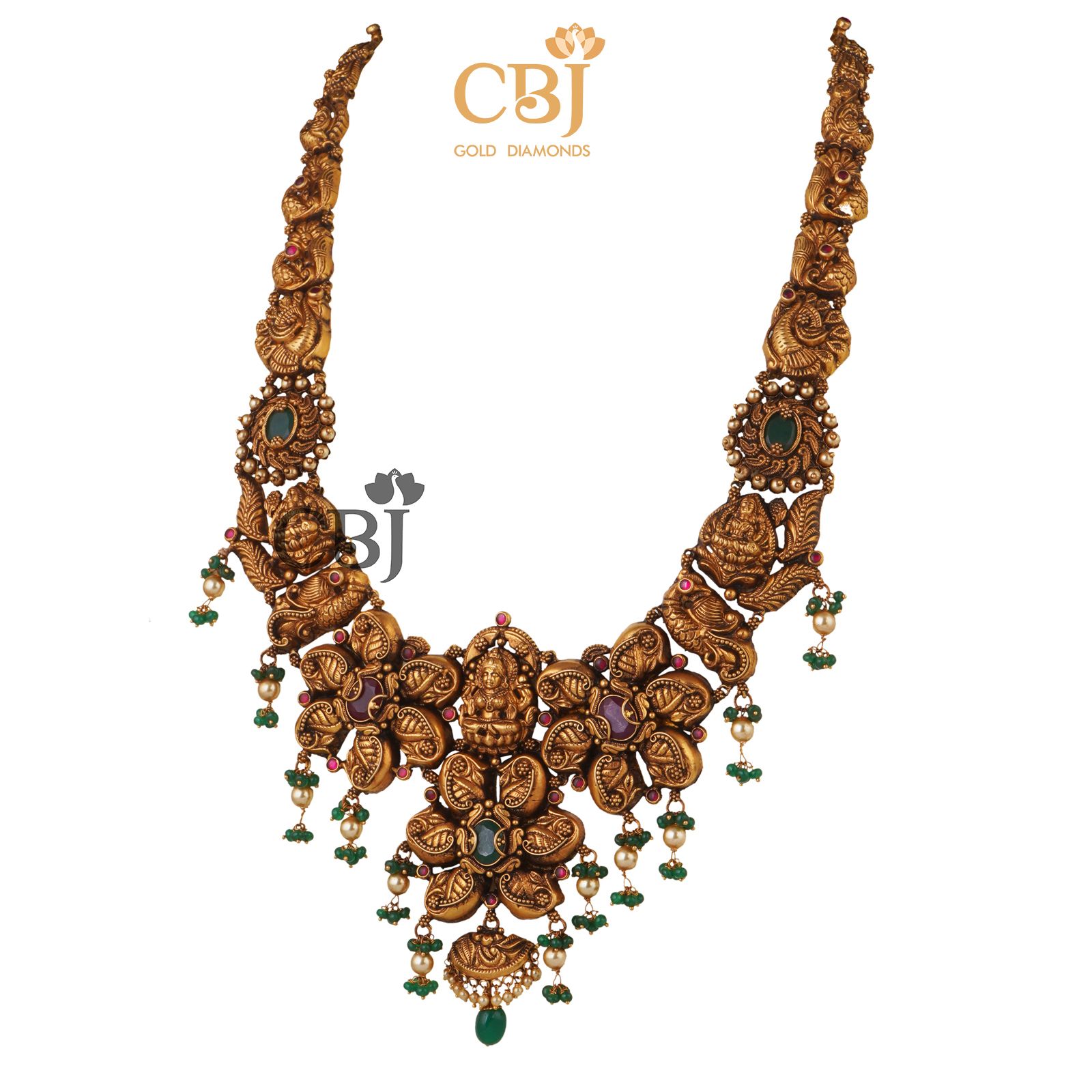 Be a trendsetter with this anique nakas U haram featuring rubies and emeralds.
