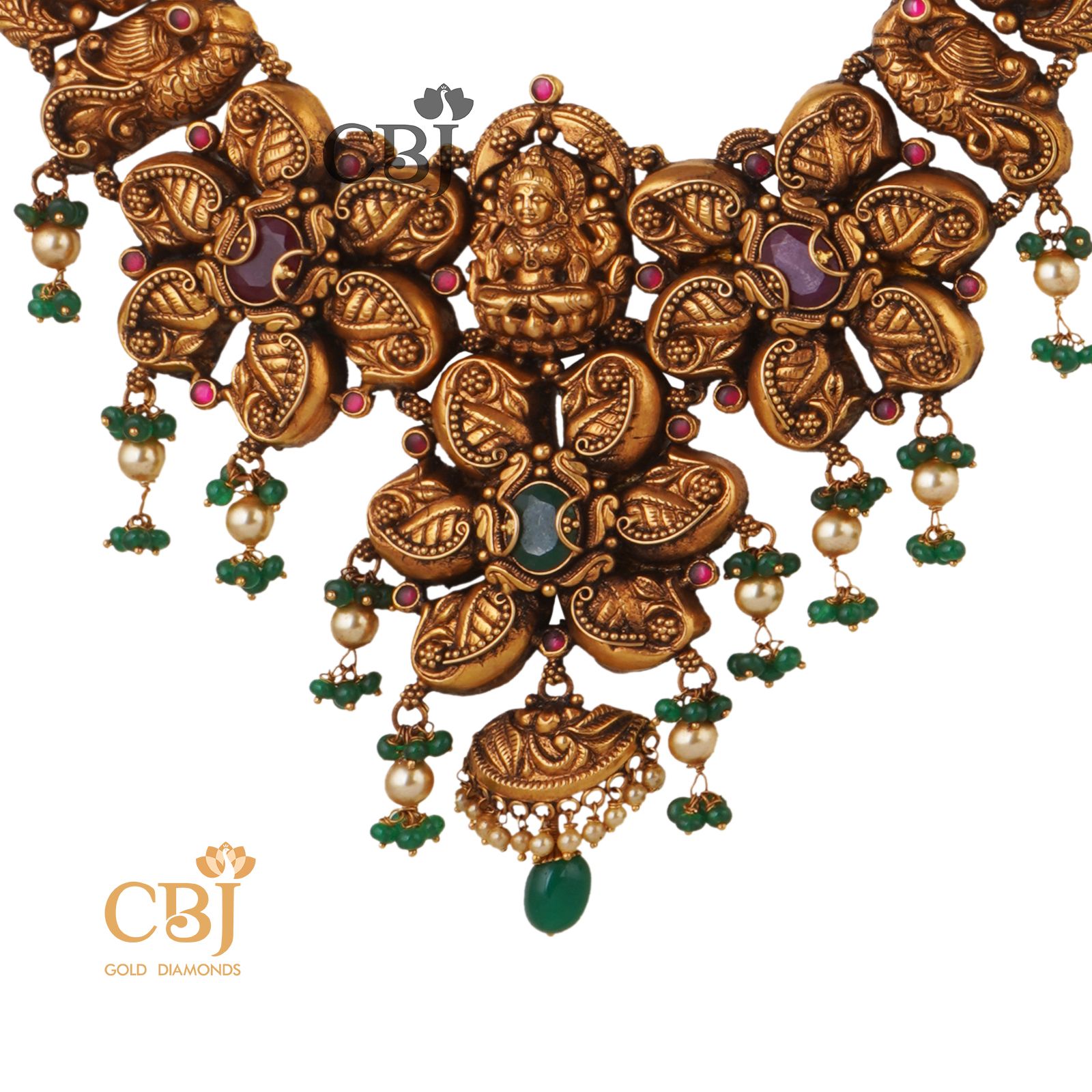 Be a trendsetter with this anique nakas U haram featuring rubies and emeralds.