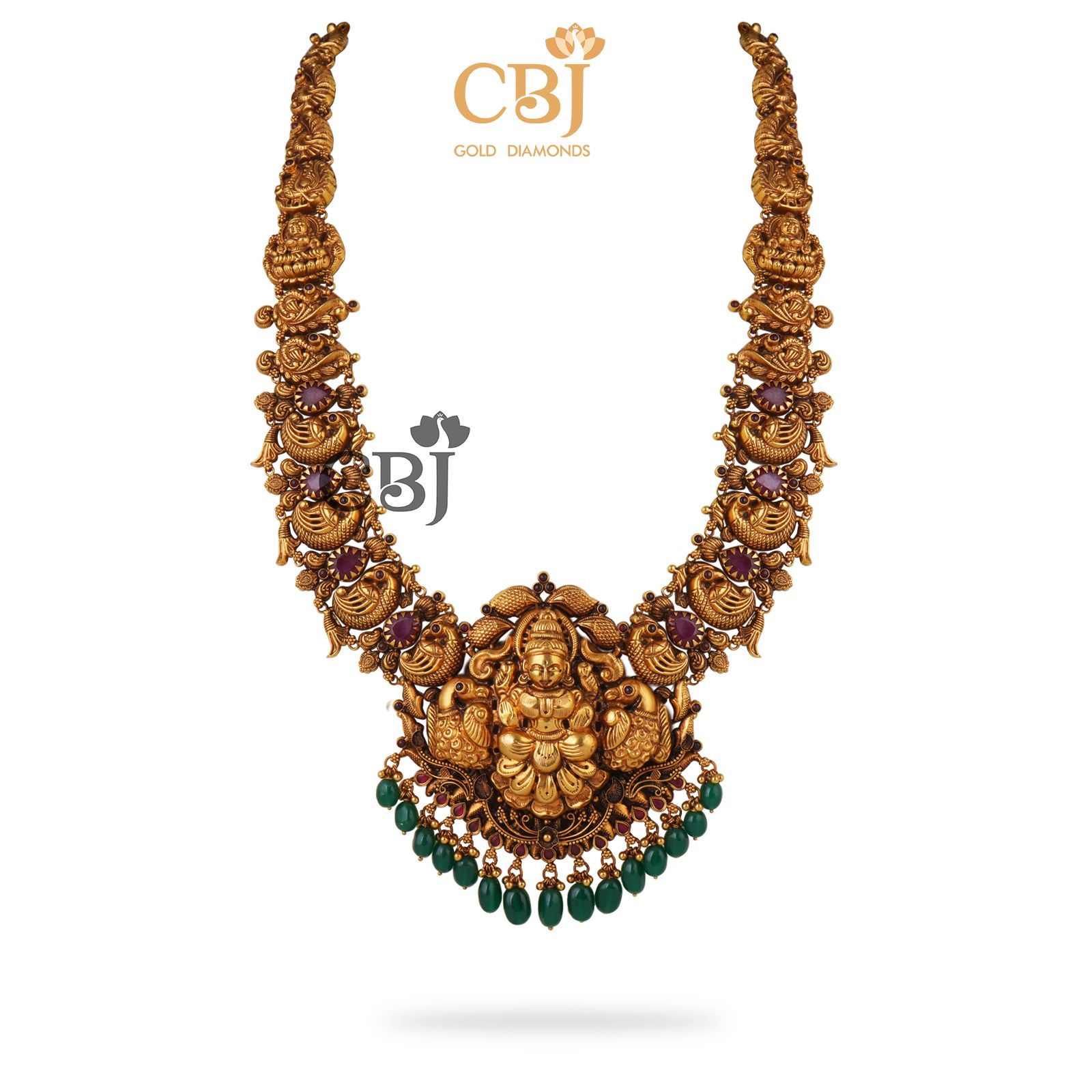 Rubies, emeralds and gold. A perfect trio for a perfect look. This antique nakashi haram features just that.