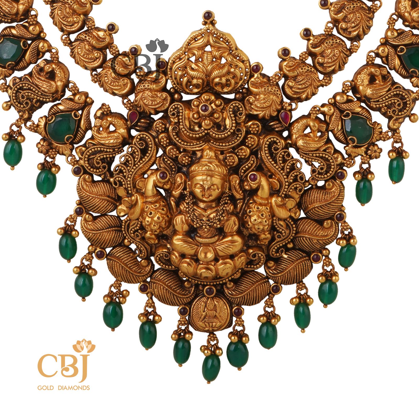 A long antique nakashi necklace studded with the richness of emerald stones.