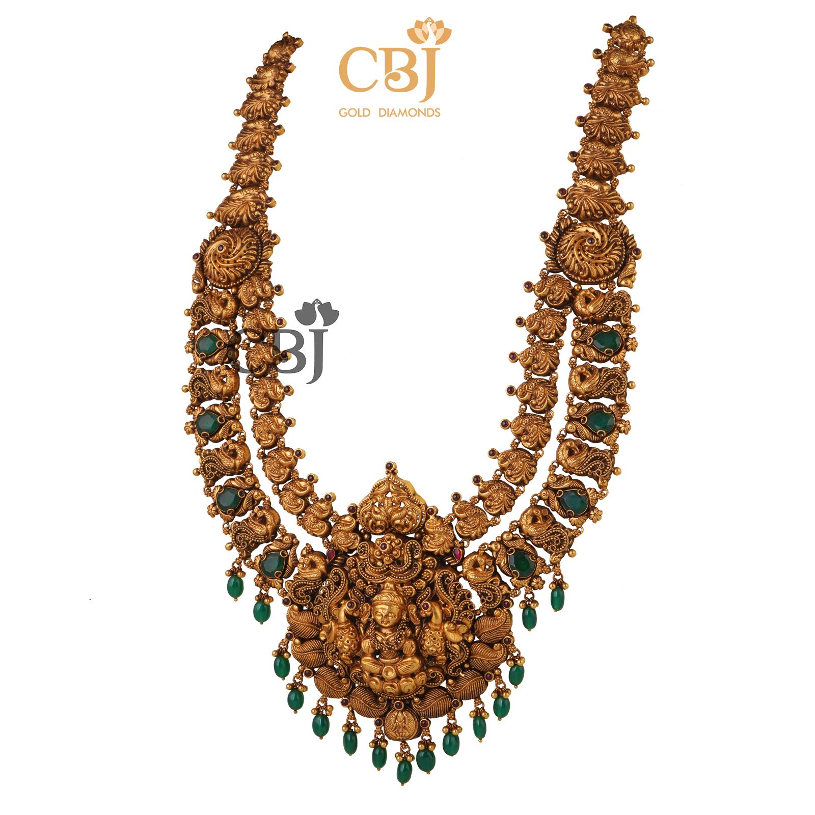 A long antique nakashi necklace studded with the richness of emerald stones.