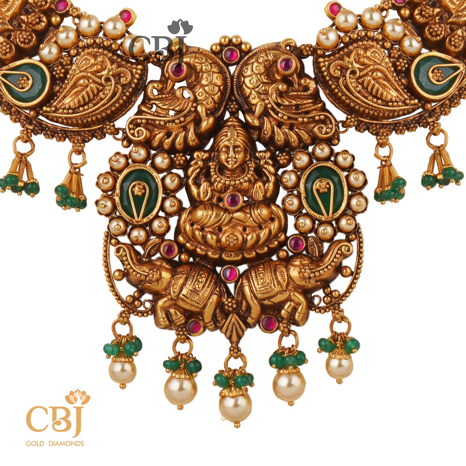 Keeping traditions alive with this simple antique necklace studded with emeralds and pearls.