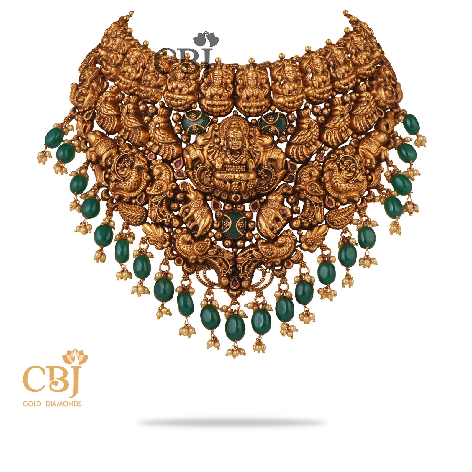 Grandeur itself is an understatement for this stunning magnificence of a design. A rich in design antique Mahalakshmi choker studded with emerald stones. 