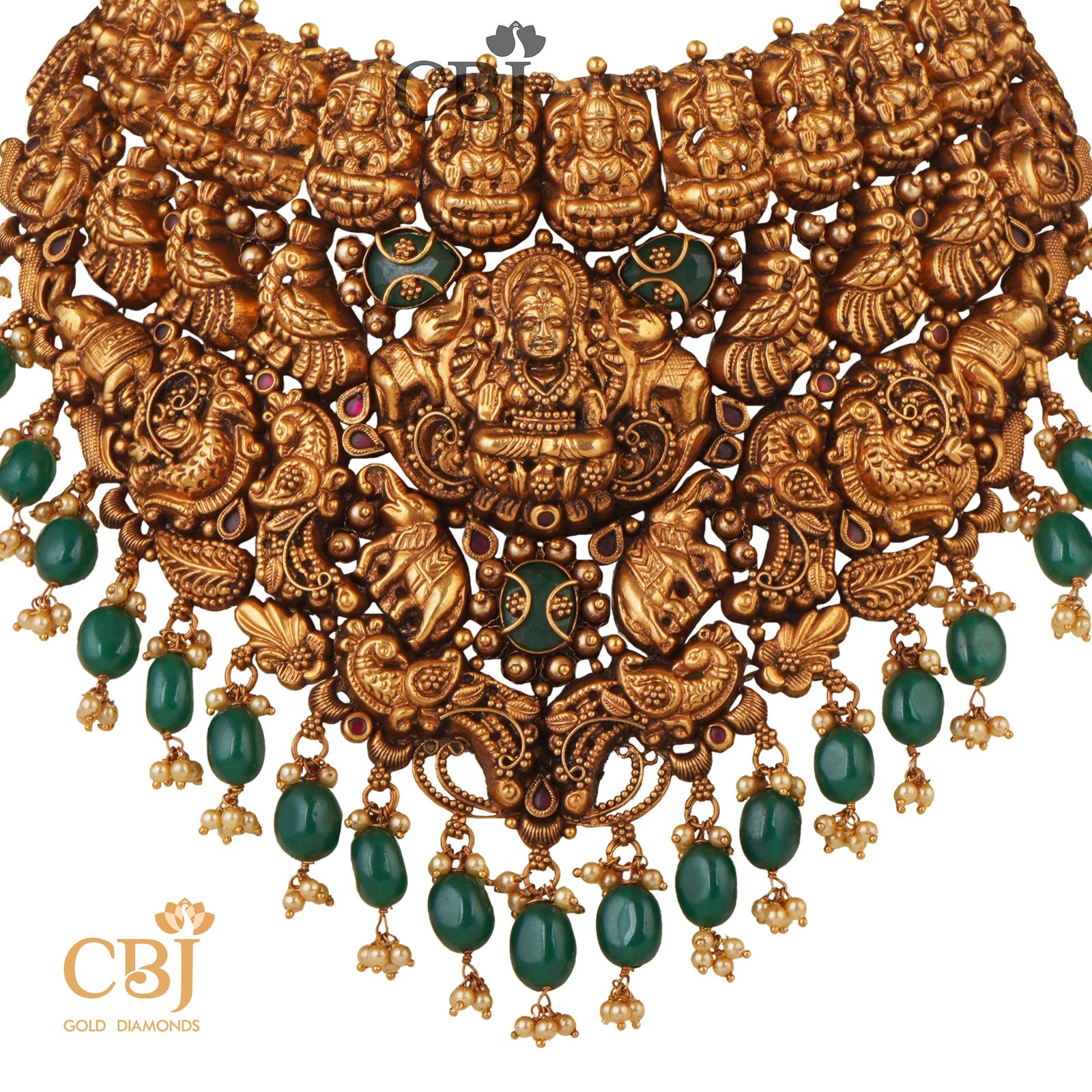 Grandeur itself is an understatement for this stunning magnificence of a design. A rich in design antique Mahalakshmi choker studded with emerald stones.