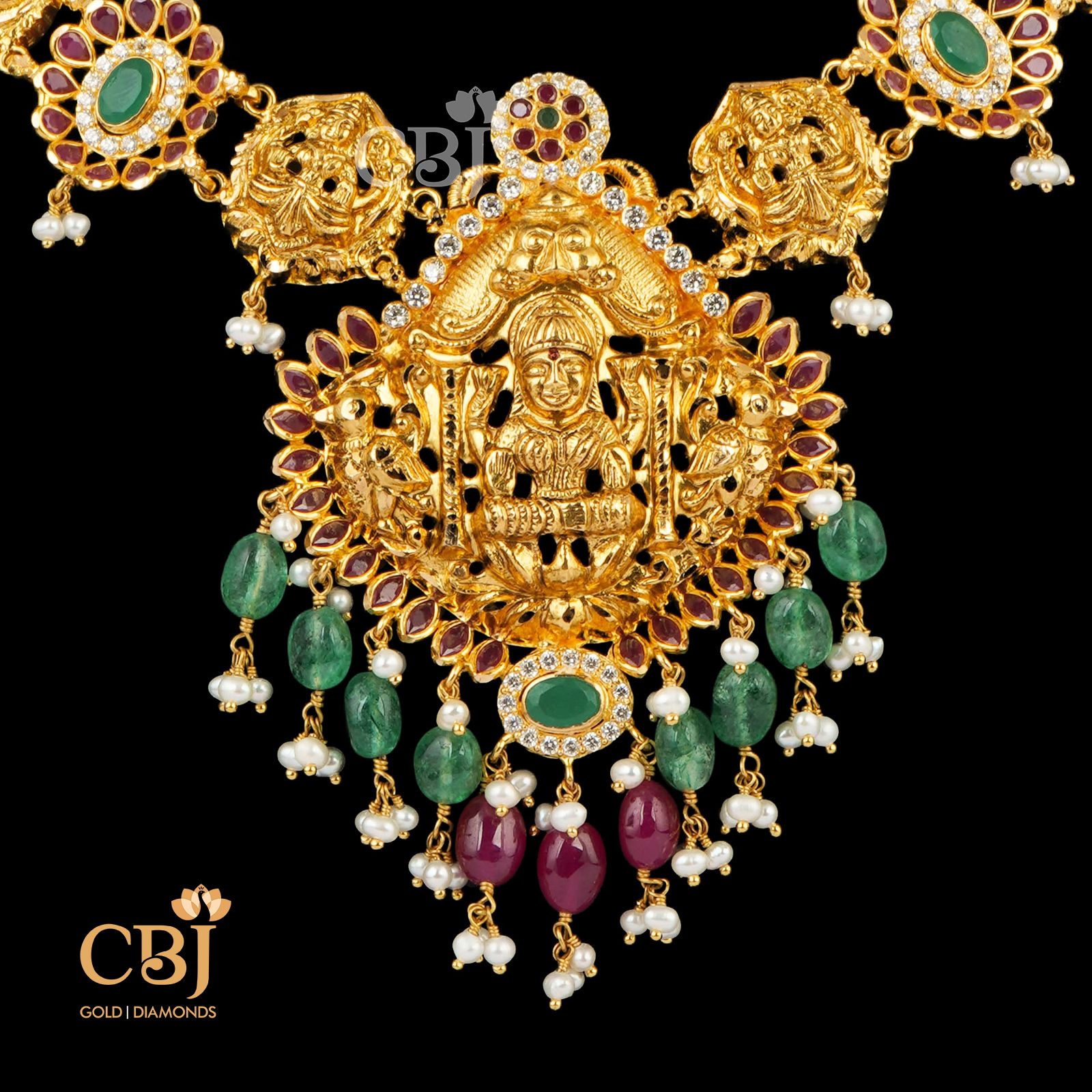 A simple light weight necklace featuring rubies and emeralds in 22k gold.