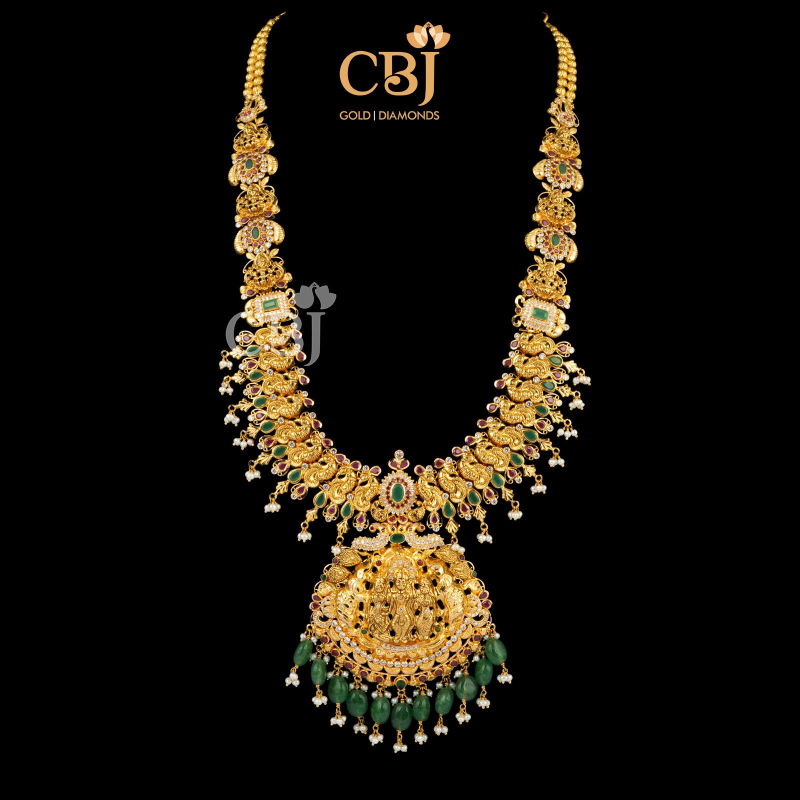 Light weight long U haram featuring emeralds and micro-pearls.