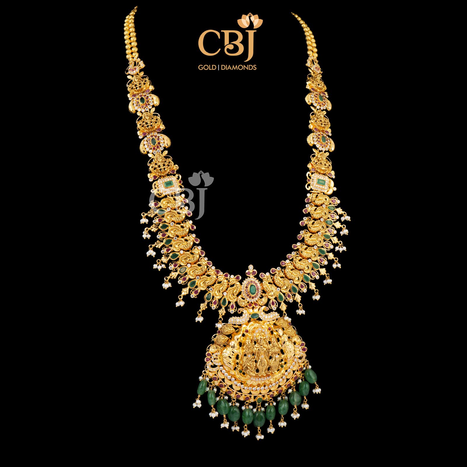 Light weight long U haram featuring emeralds and micro-pearls.