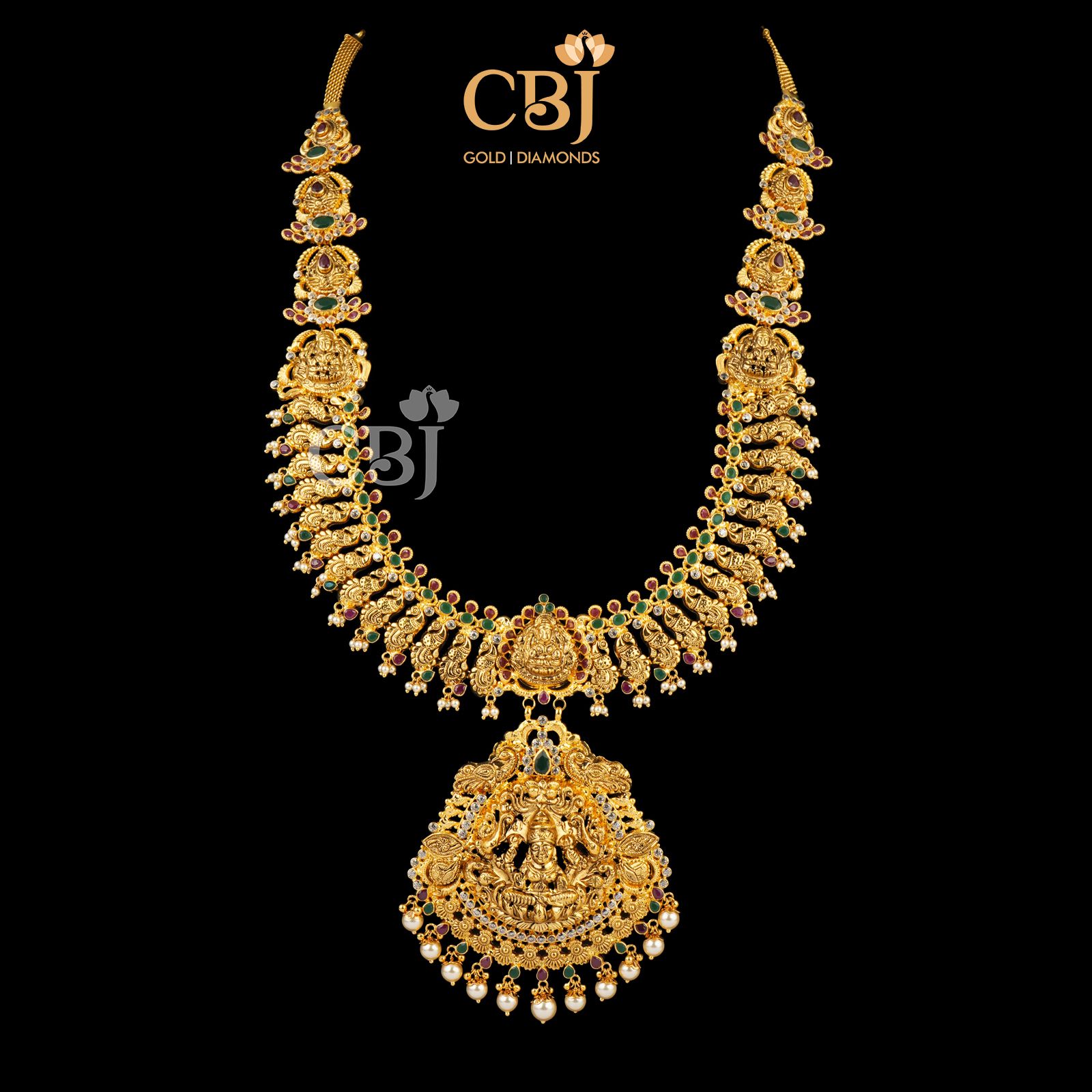 Light weight U haram featuring rubies, emeralds and pearls.