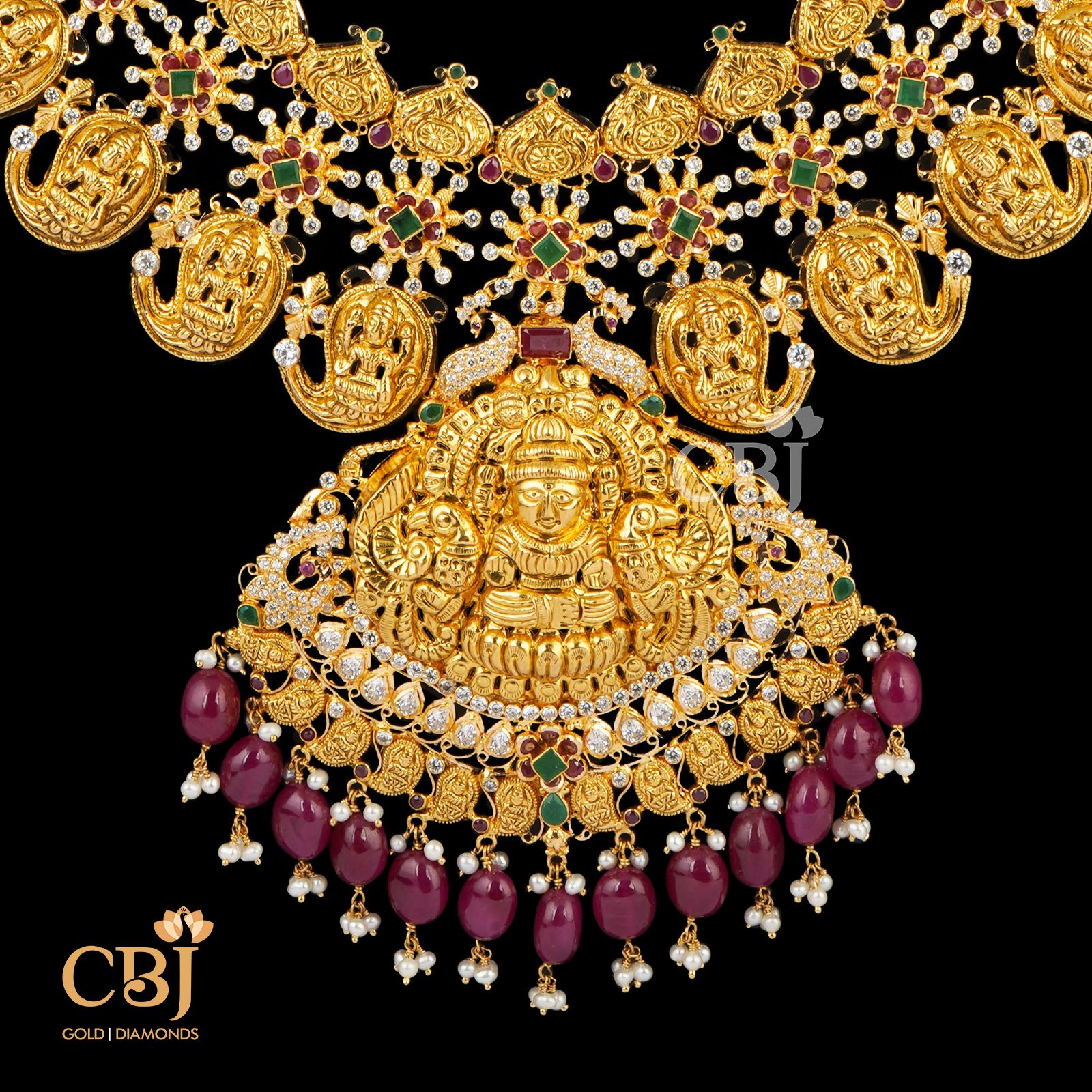 A bright mango U-Haram featuring pure 22k gold in combination with rubies and cz stones.