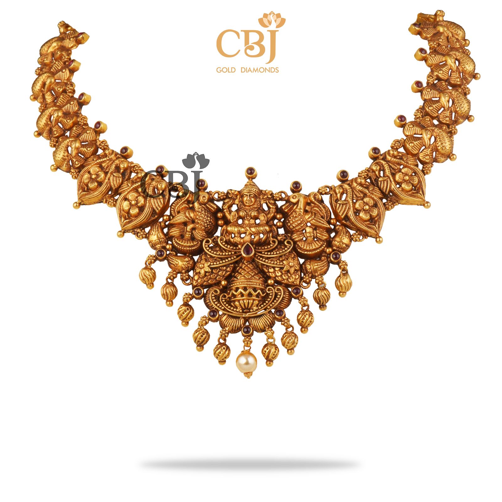 A rich antique designer necklace studded with ruby potas.