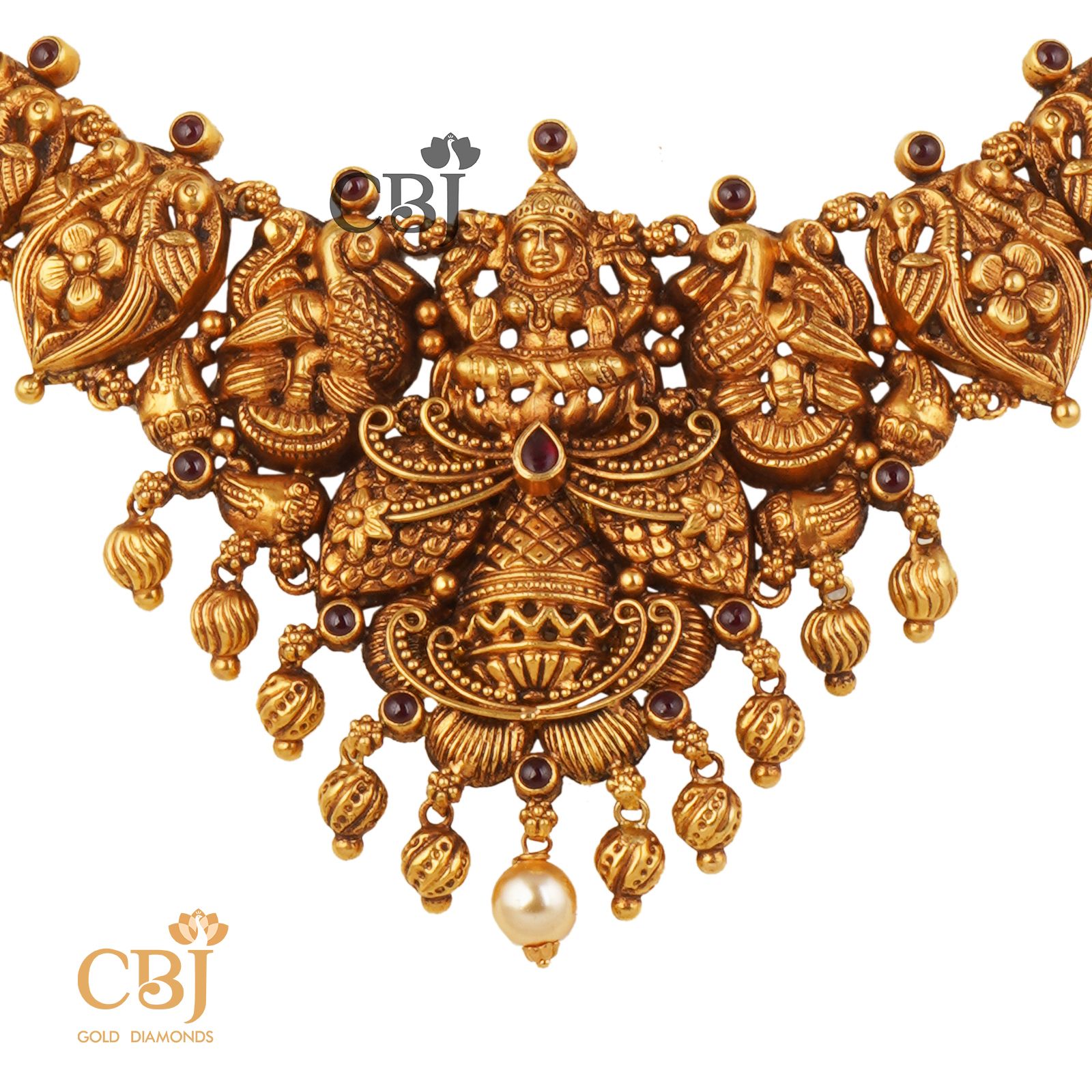 A rich antique designer necklace studded with ruby potas.