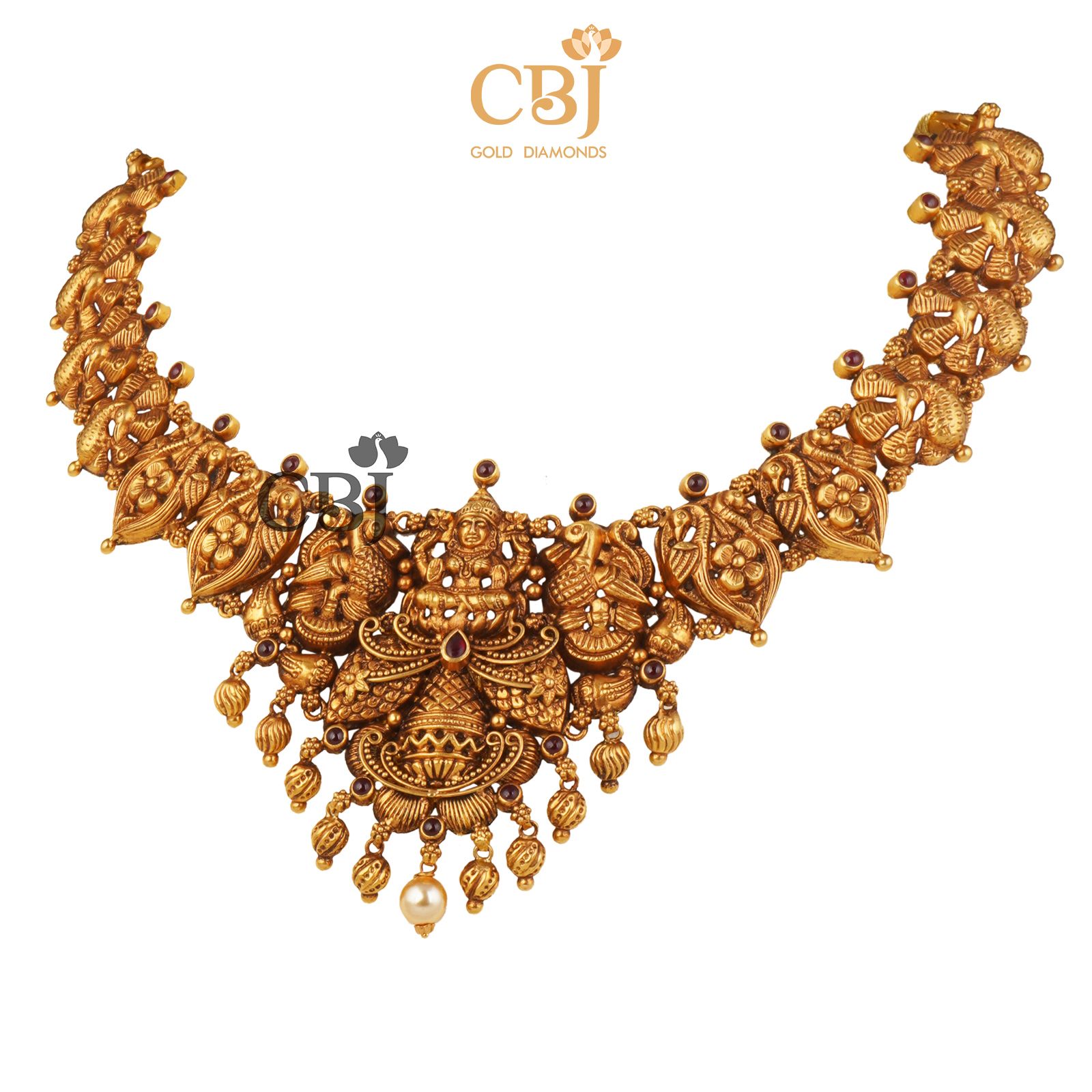 A rich antique designer necklace studded with ruby potas.
