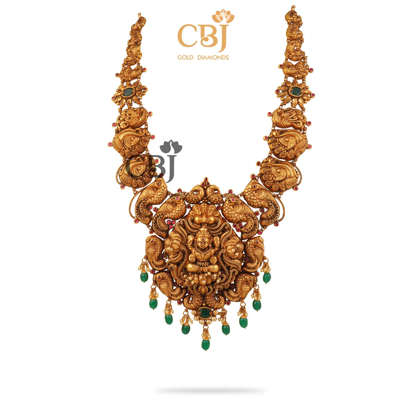 Antique Haram featuring deep nakas work studded with emerald stones.