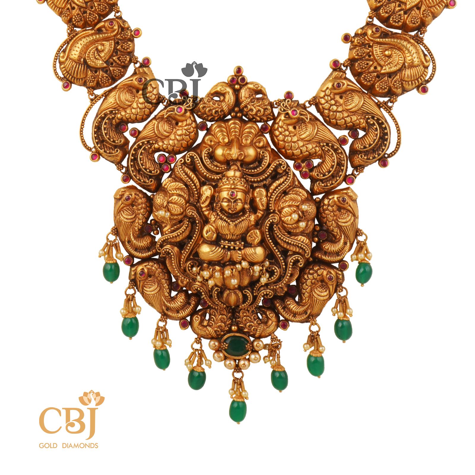 Antique Haram featuring deep nakas work studded with emerald stones.