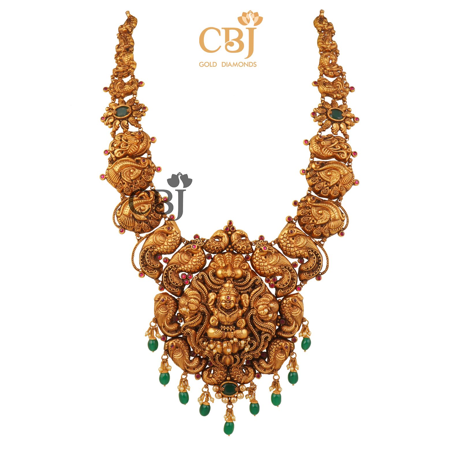 Antique Haram featuring deep nakas work studded with emerald stones.