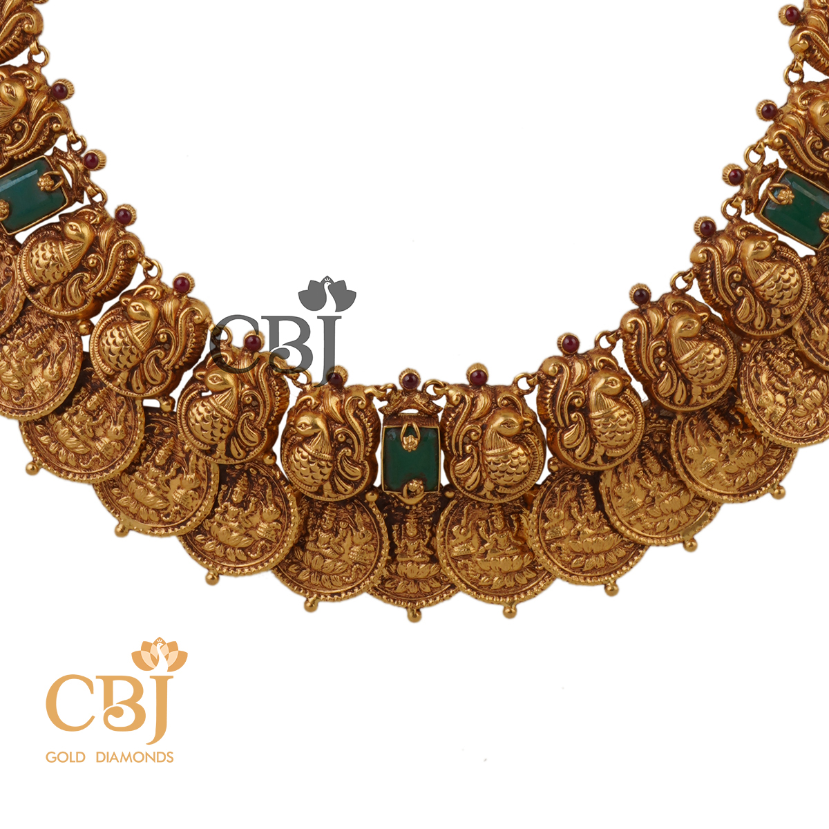 A grand heavy kasumala studded with emerald stones