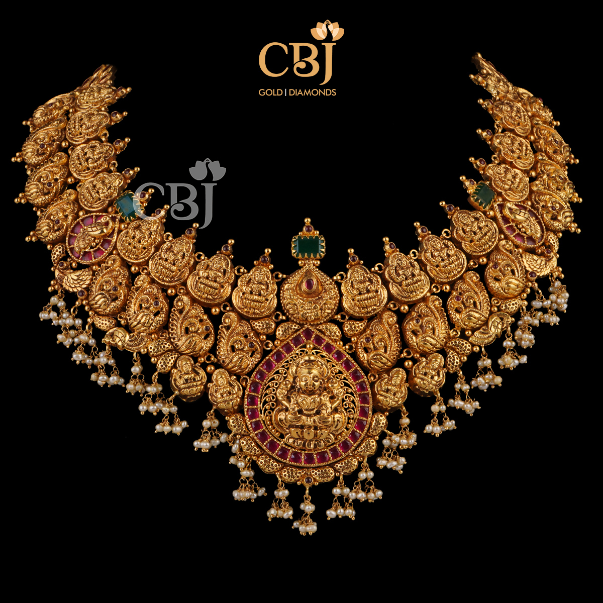 A supreme splendour, a grand delight and what not. An antique nakashi necklace studded with rubies, emeralds and micro-pearls.