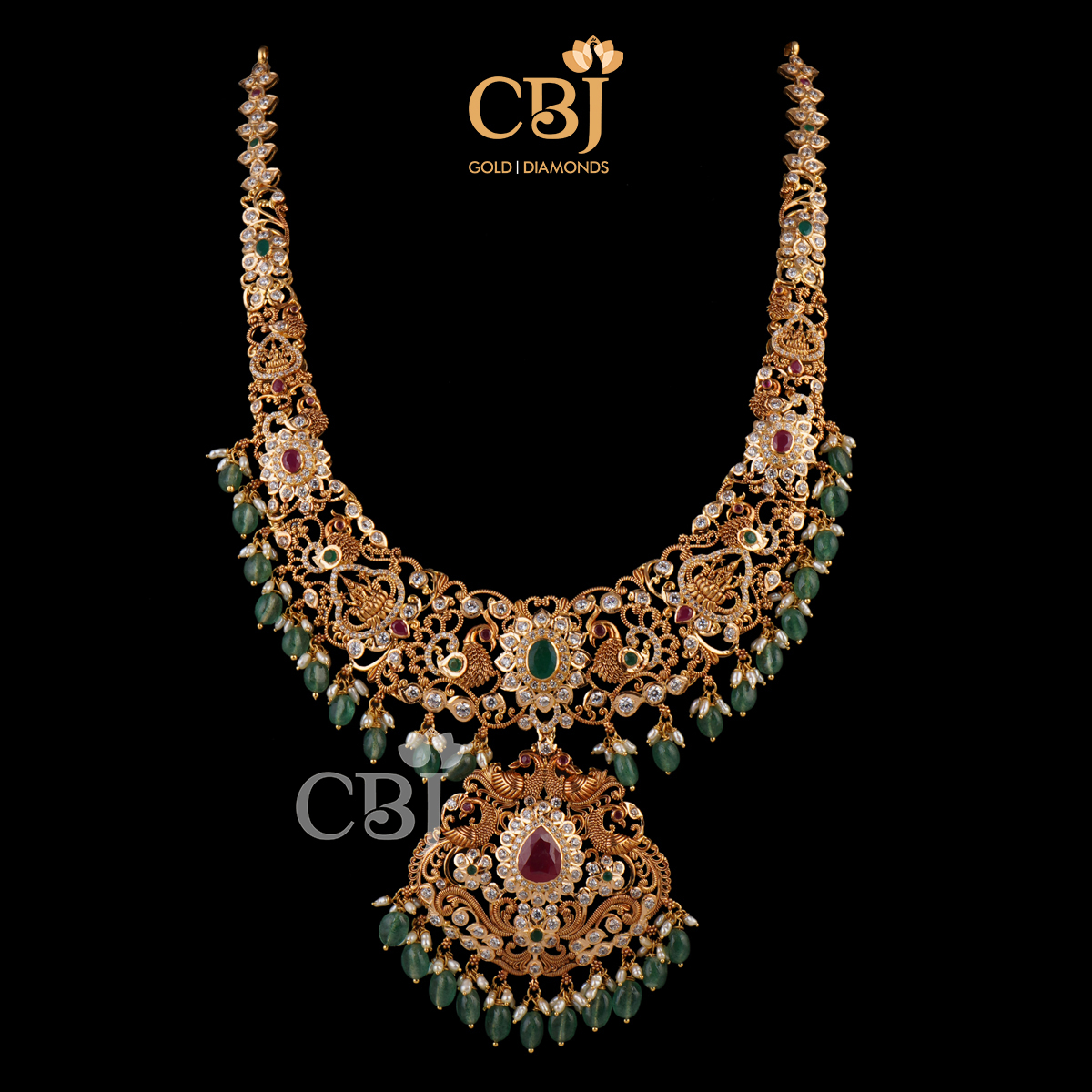 A dazzling designer CZ pachu U haram with emerald drops.
