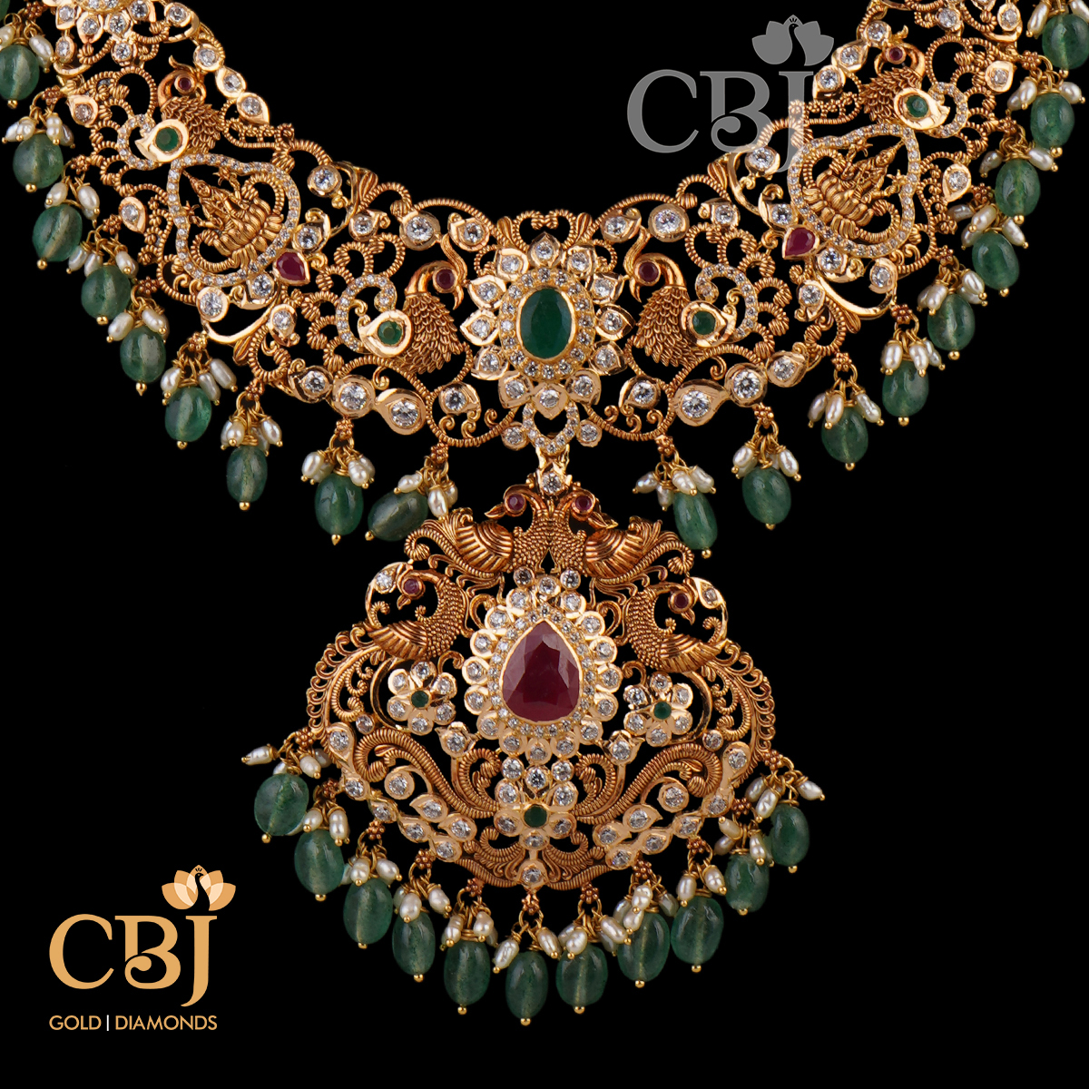 A dazzling designer CZ pachu U haram with emerald drops.