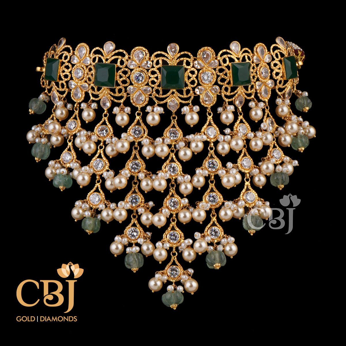 A design depicting a fusion of stones. A unique ultra fashionable light weight choker featuring pearls and emeralds in drop style.