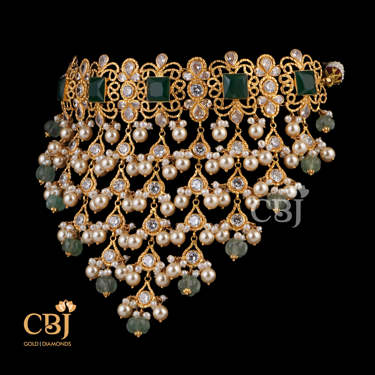 A design depicting a fusion of stones. A unique ultra fashionable light weight choker featuring pearls and emeralds in drop style.
