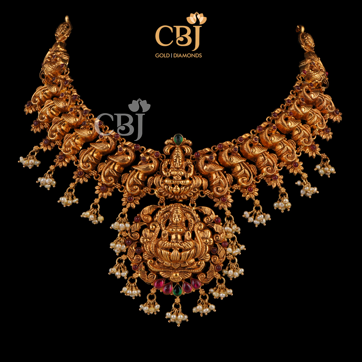 Antique kante with peacock motifs featuring rubies and micro-pearls.