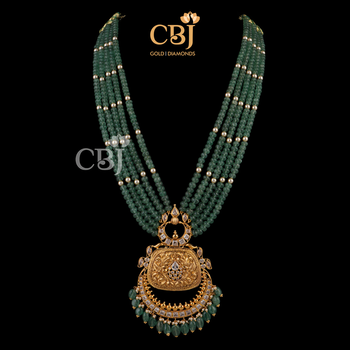 Antique nakashi necklace featuring rubies, emeralds and micro-pearls.