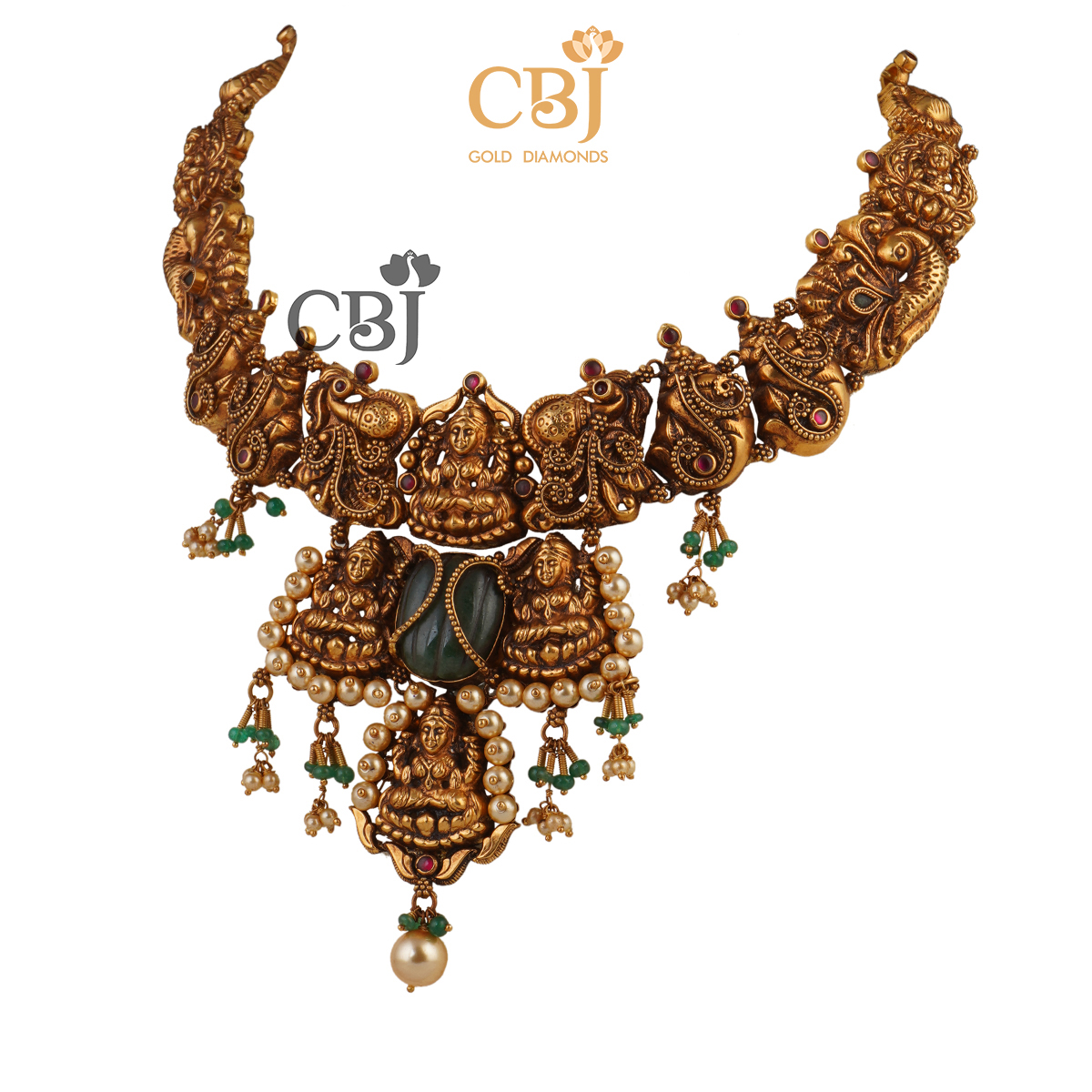 A unique antique nakashi necklace featuring ruby potas and emerald stones.