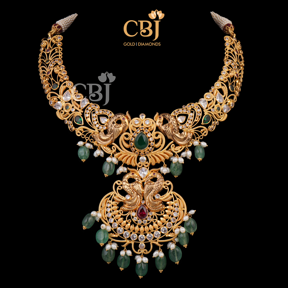 A CZ pachi kante featuring emerald and ruby stones.