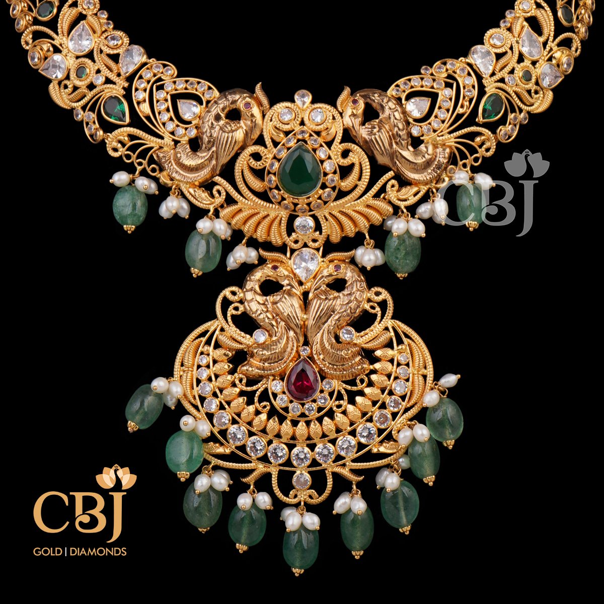 A CZ pachi kante featuring emerald and ruby stones.